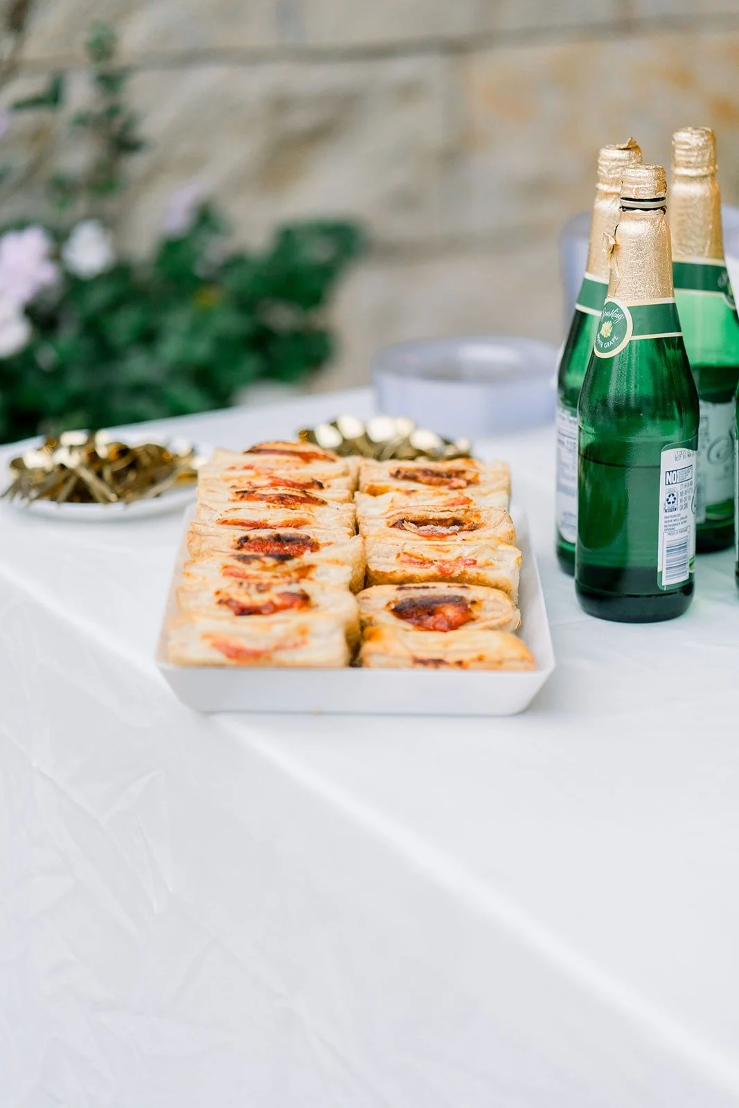 Appetizers and bottled drinks set out on the patio