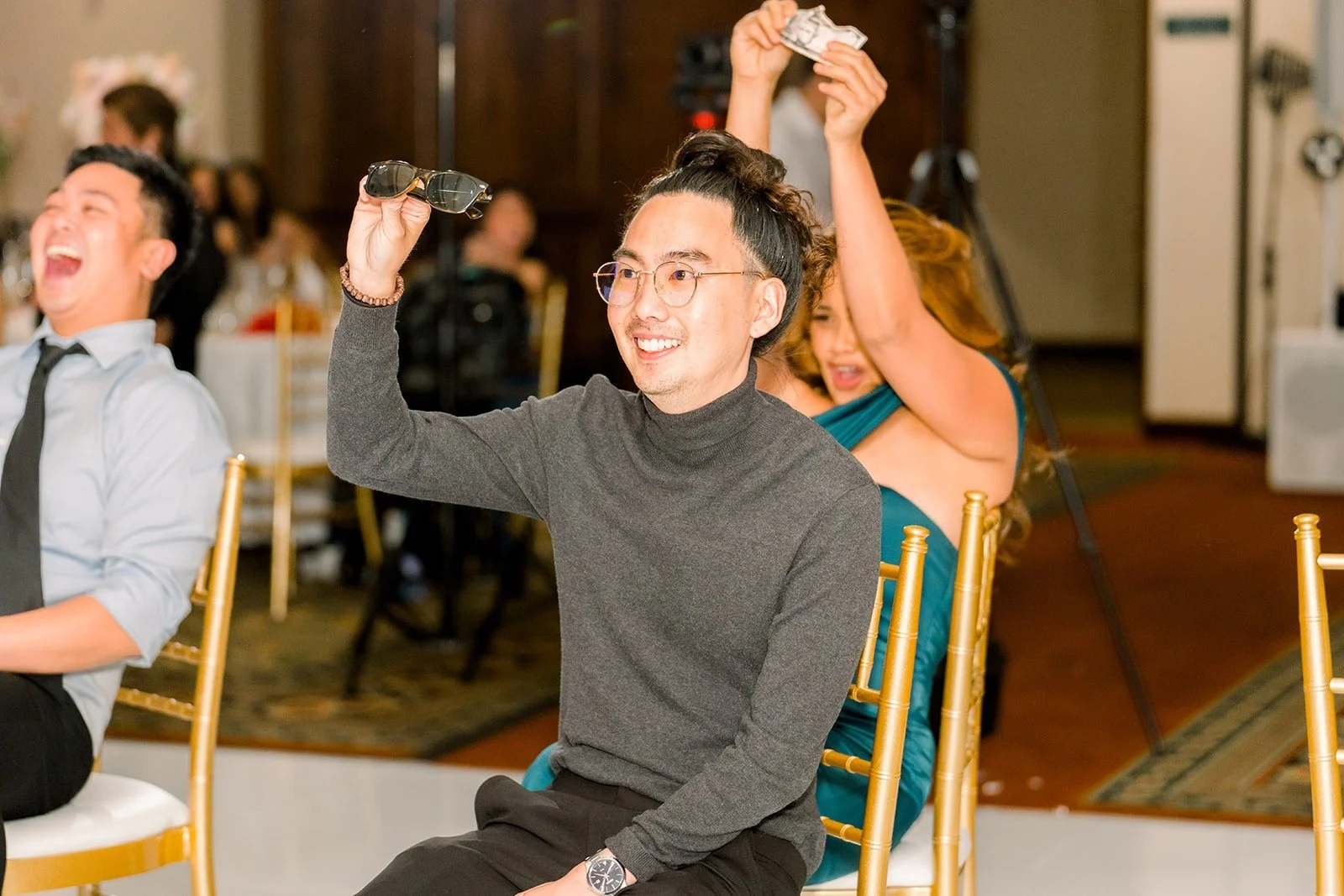 Guests celebrating at their tables during a game