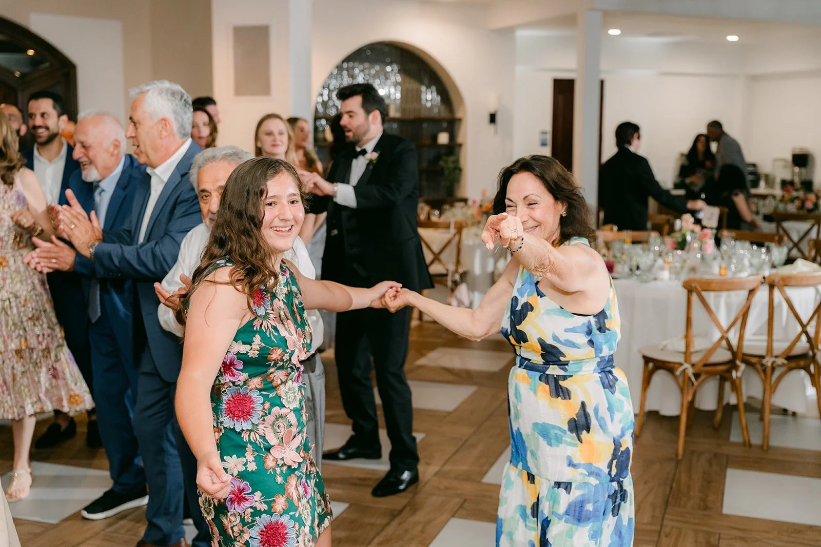 Guests dancing in the reception room at Sterling Hills