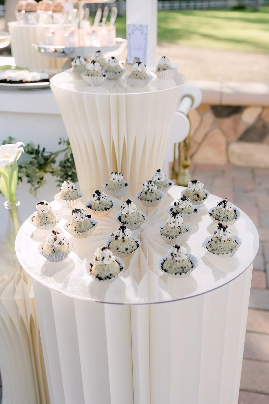 Cupcakes displayed on a pleated white stand