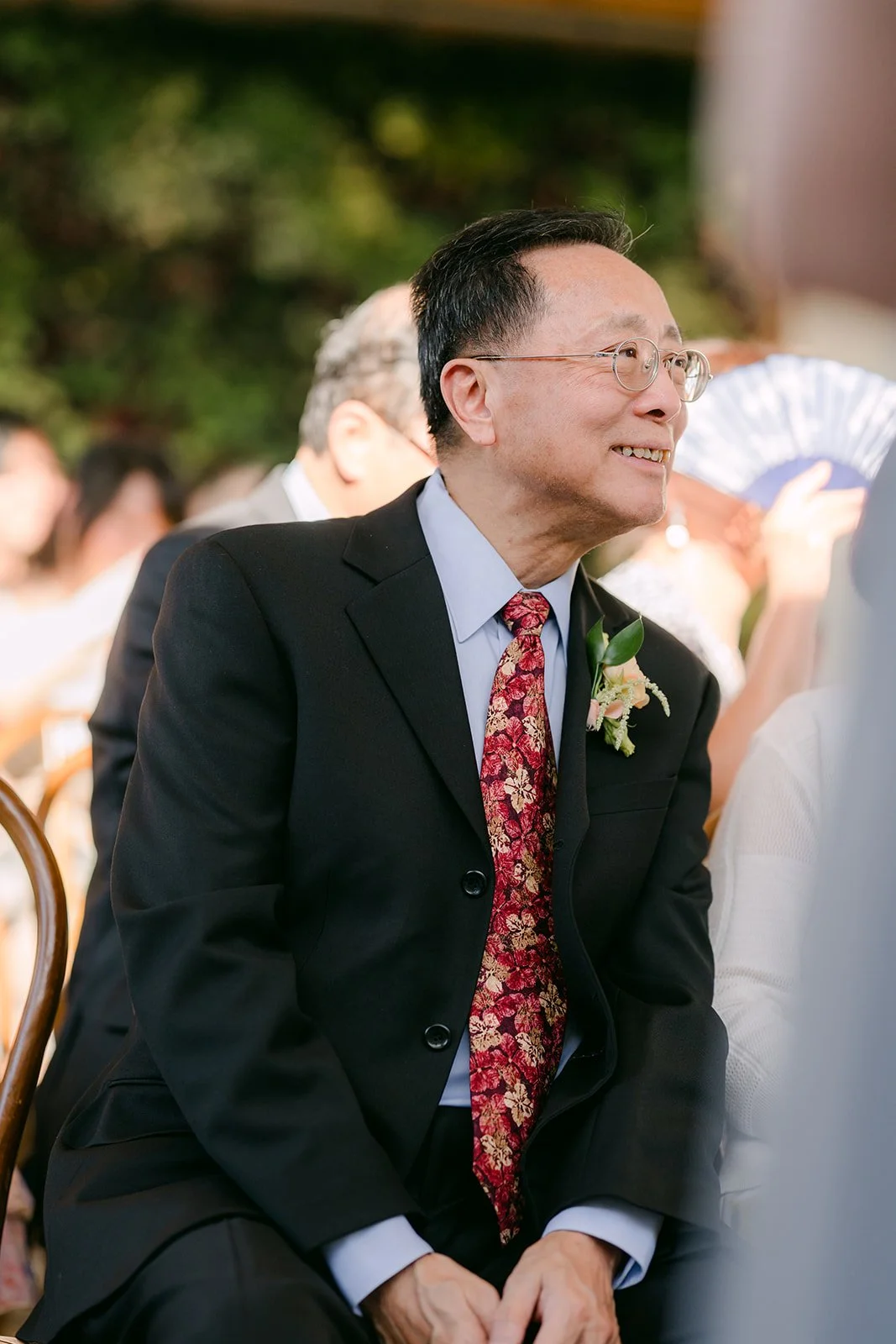 Family member smiling during the vows
