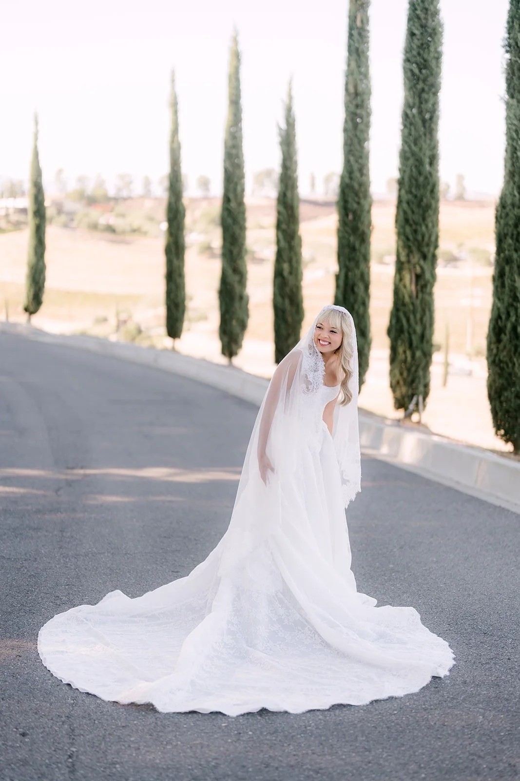 Konitha on the cypress lined drive at Bel Vino Winery