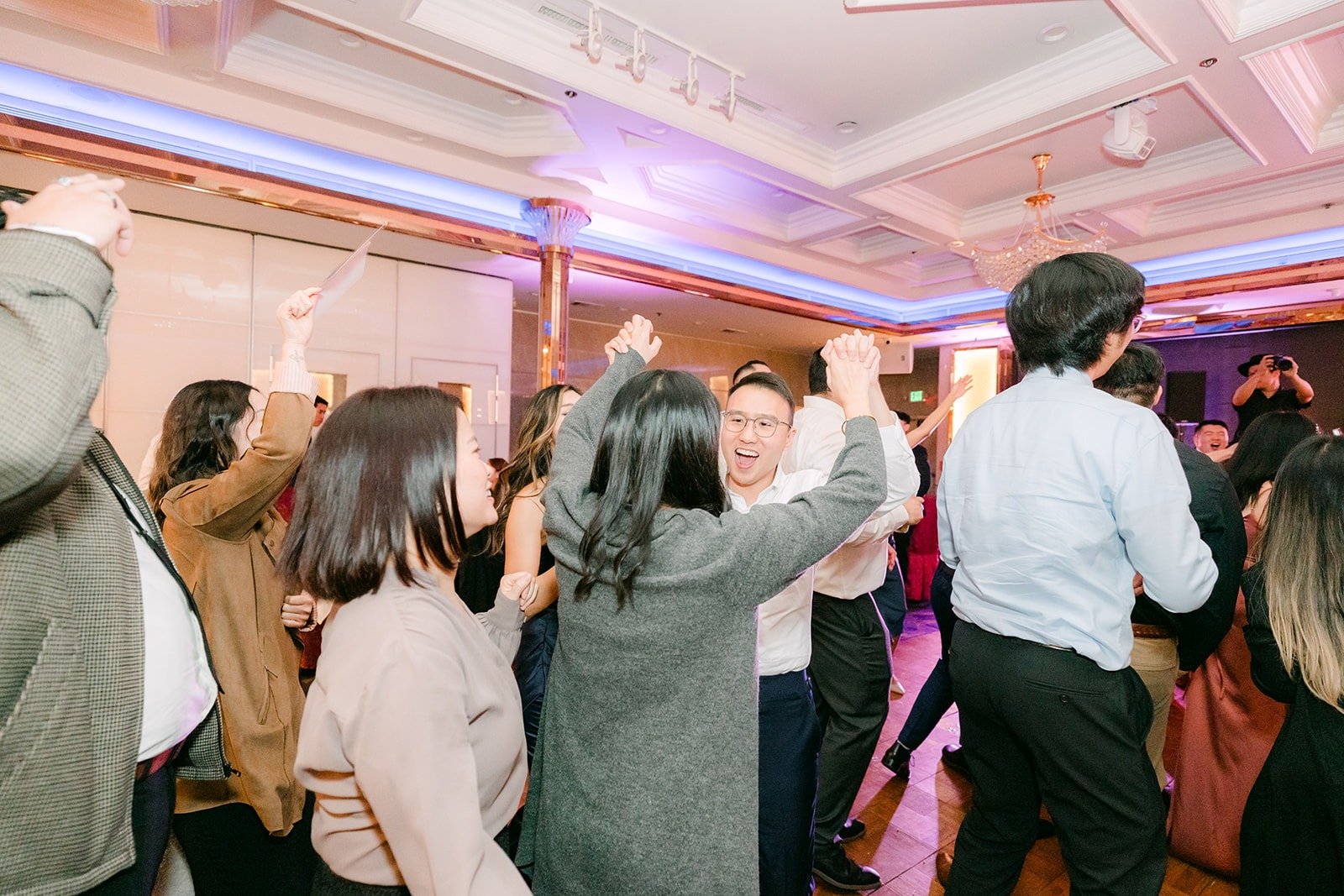 The dance floor in full swing under purple lights