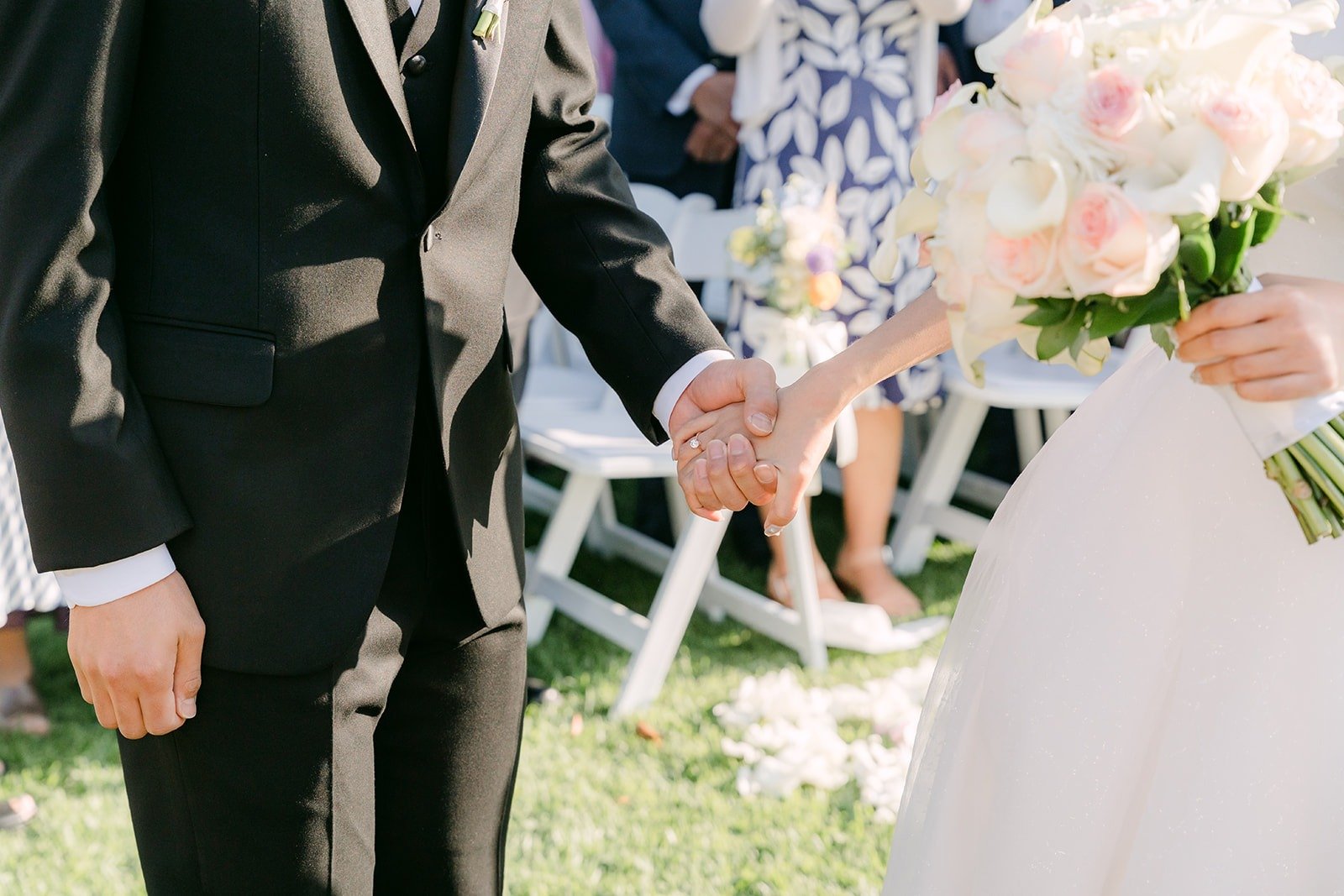 Close up of Jeannie and Eunsang's hands at the start of the ceremony