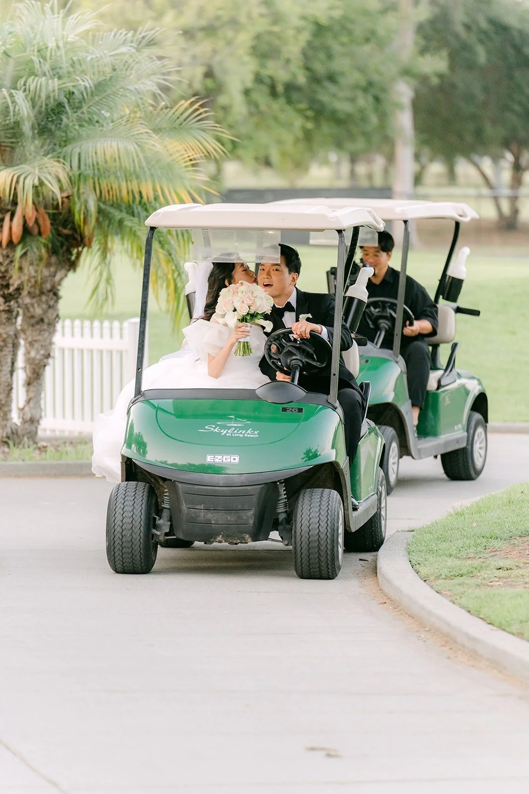 Jeannie and Eunsang sharing a kiss on the golf cart