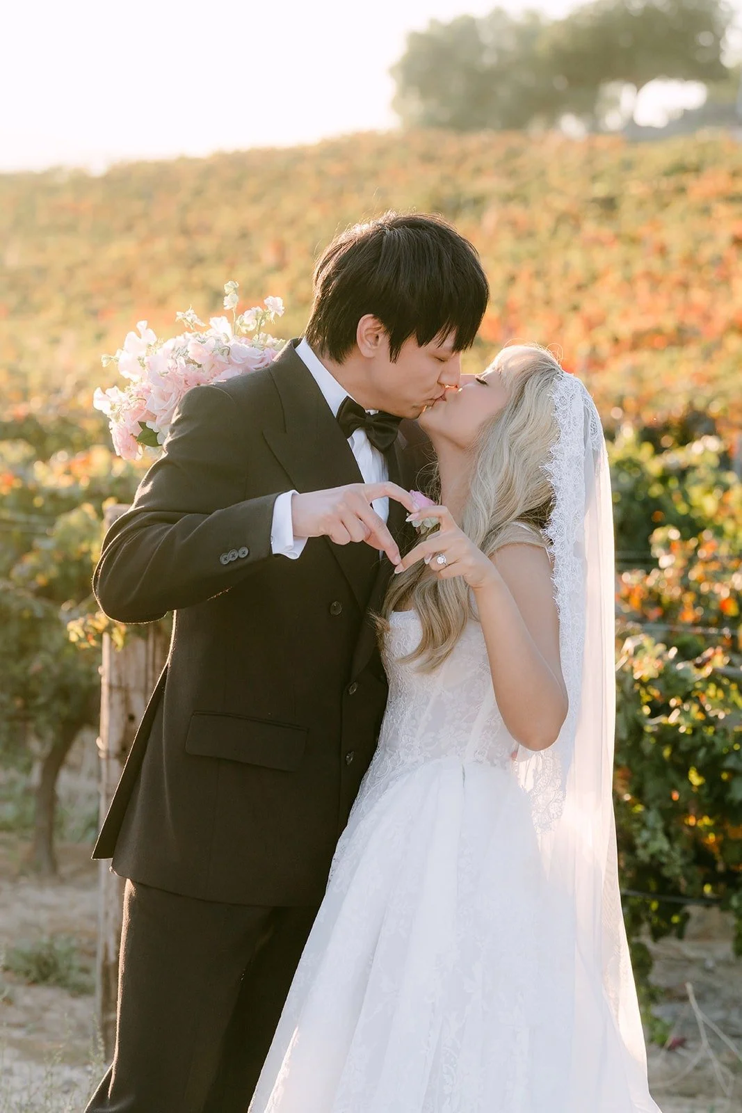 Konitha and Job sharing a kiss in the vines