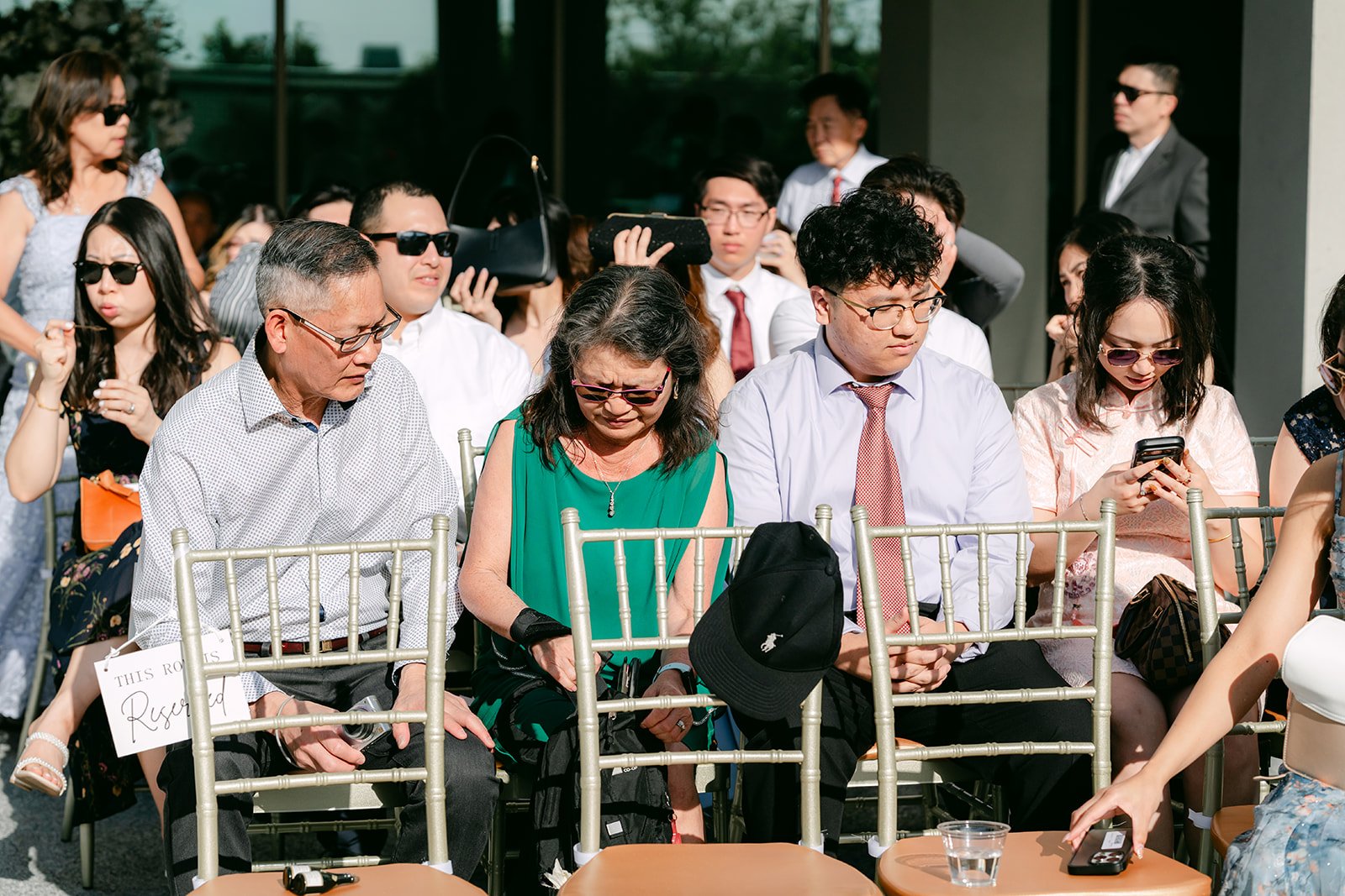 Guests seated in the gold chairs during the ceremony.