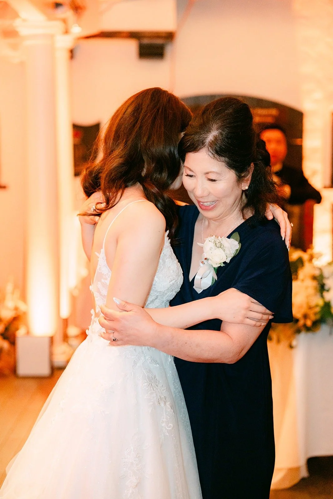 Valerie and a parent sharing a quiet moment on the dance floor