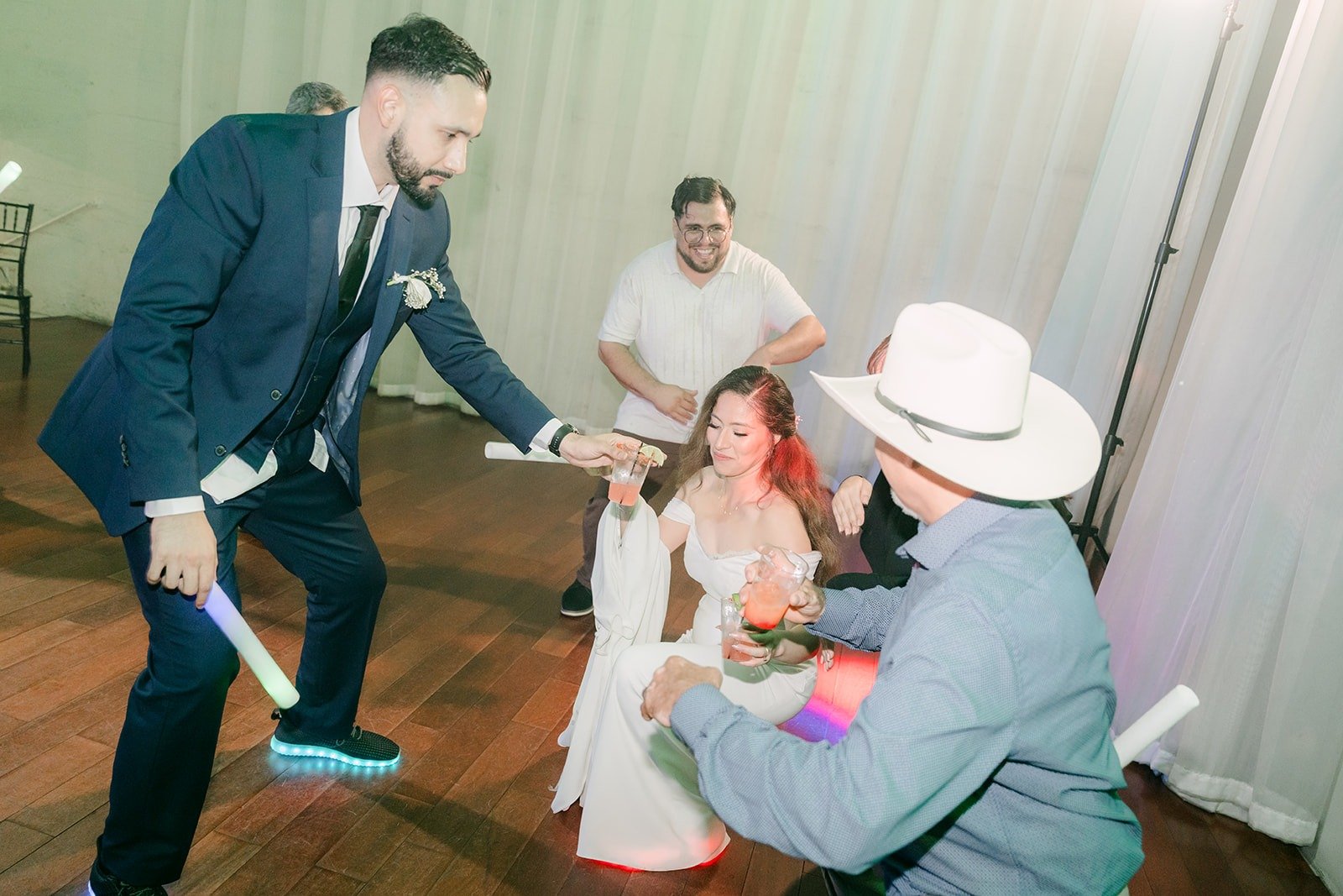 Danny and a guest dancing with Mariana in the middle of the circle