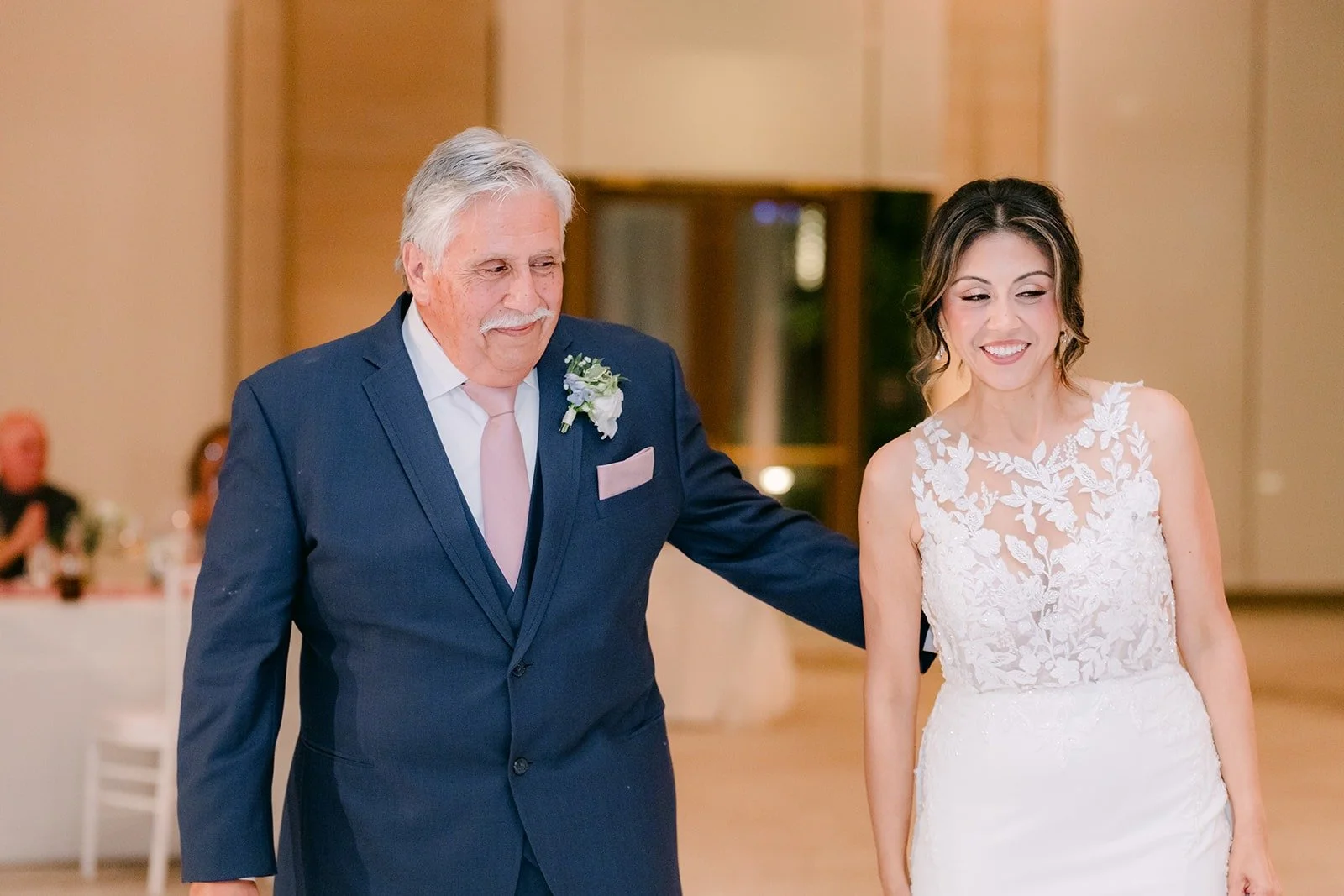 Francesca laughs with her father during their dance