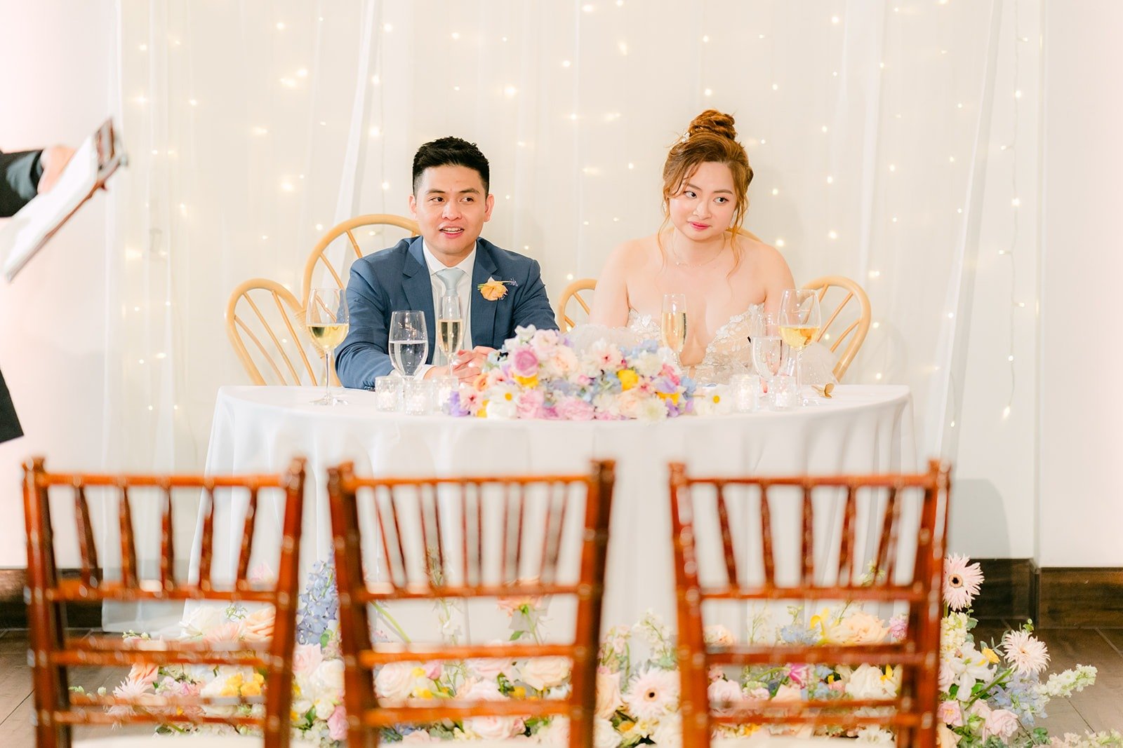 Joanna and Jerrick at the sweetheart table during a reception game