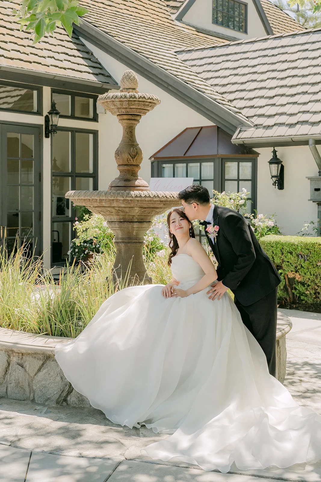 Judy and Joshua by the courtyard fountain
