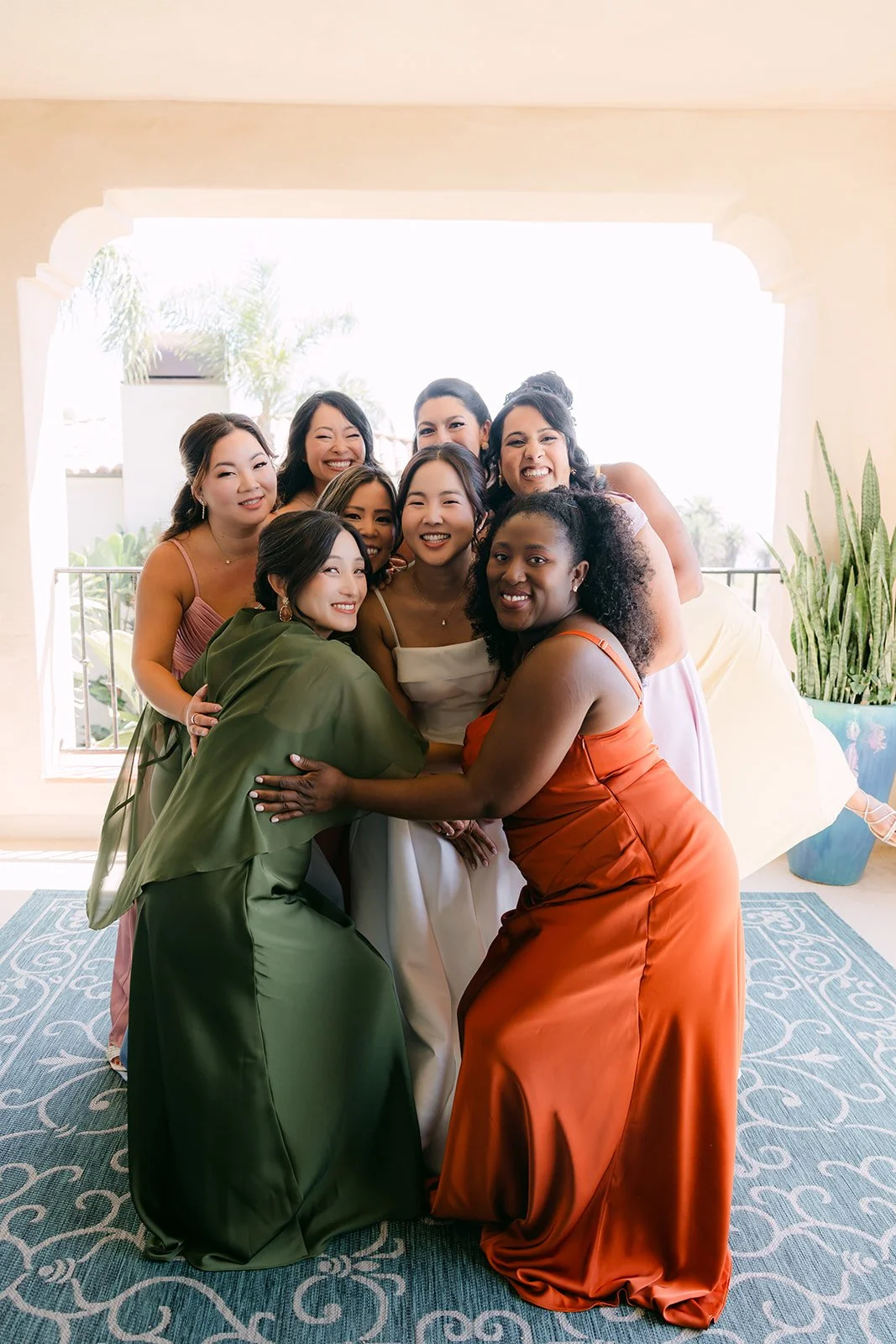 Saya hugging her bridesmaids before the ceremony