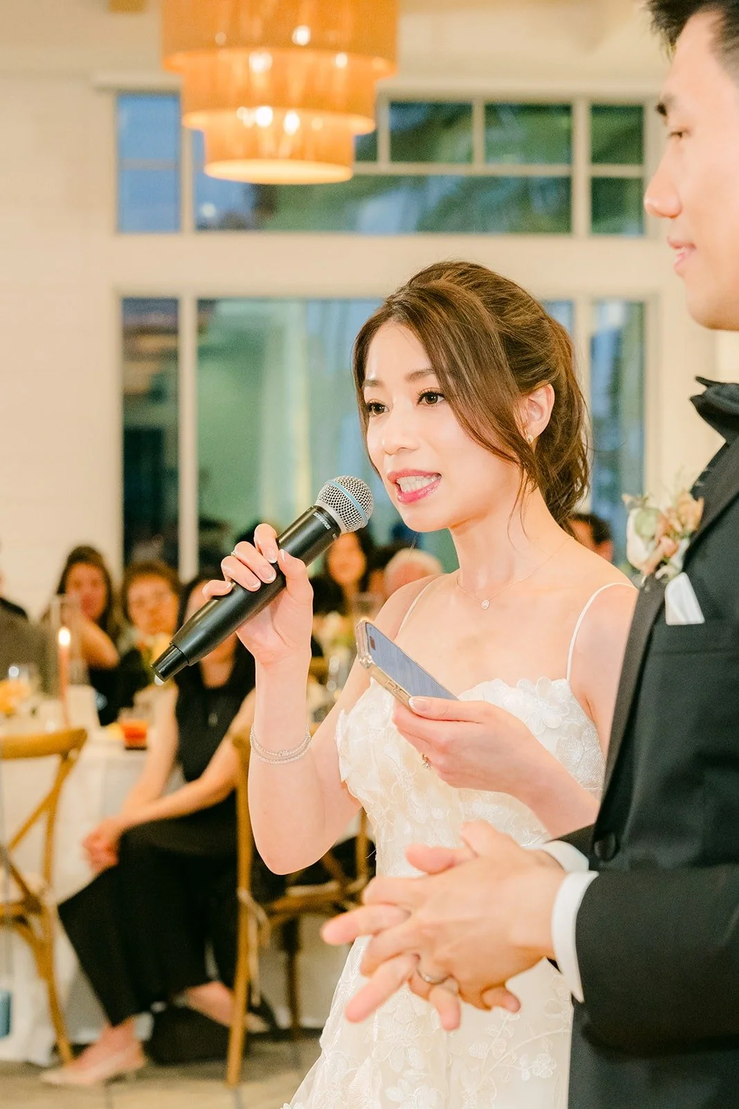 Angela giving a speech with the microphone