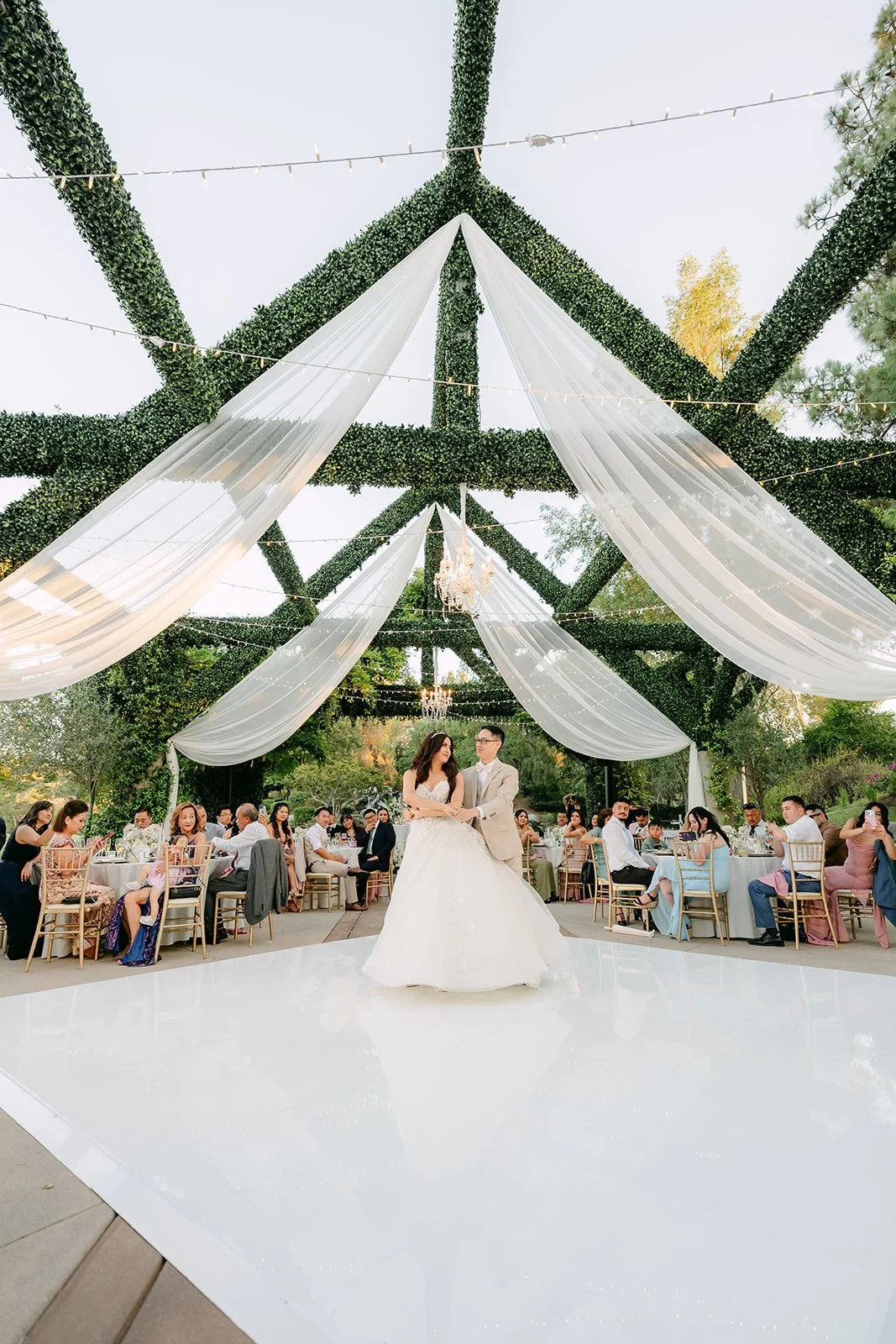 Sandra and Kevin's first dance on the dance floor under the pergola.