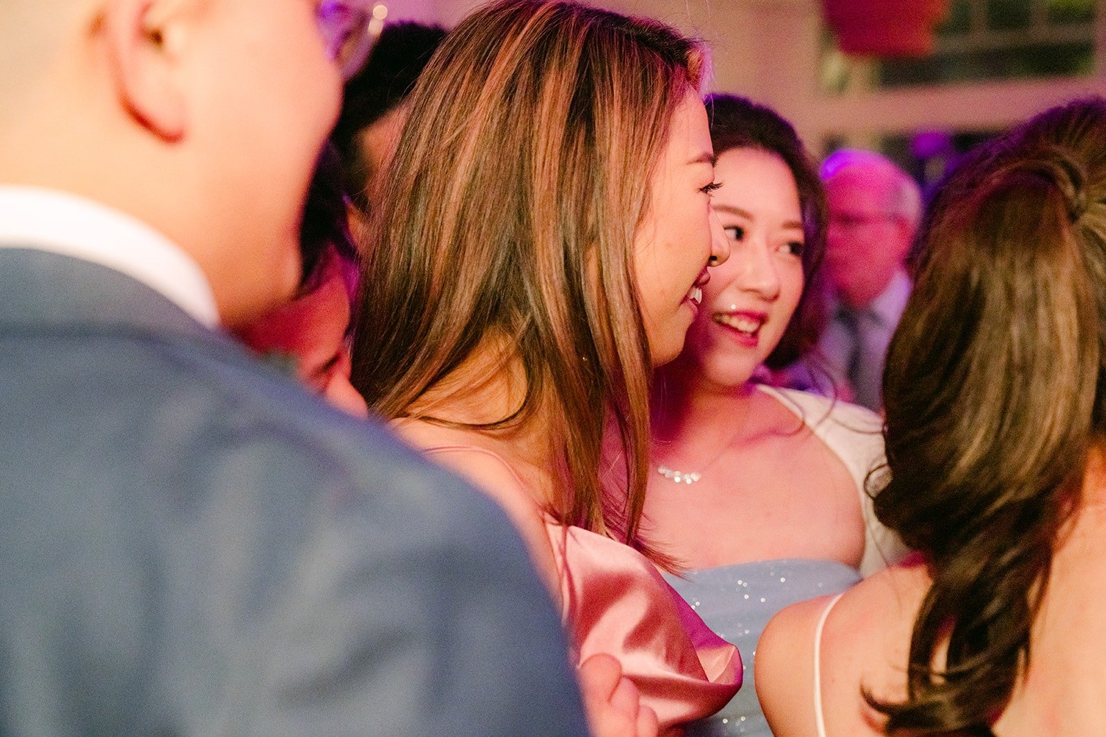 Guests singing along on the dance floor
