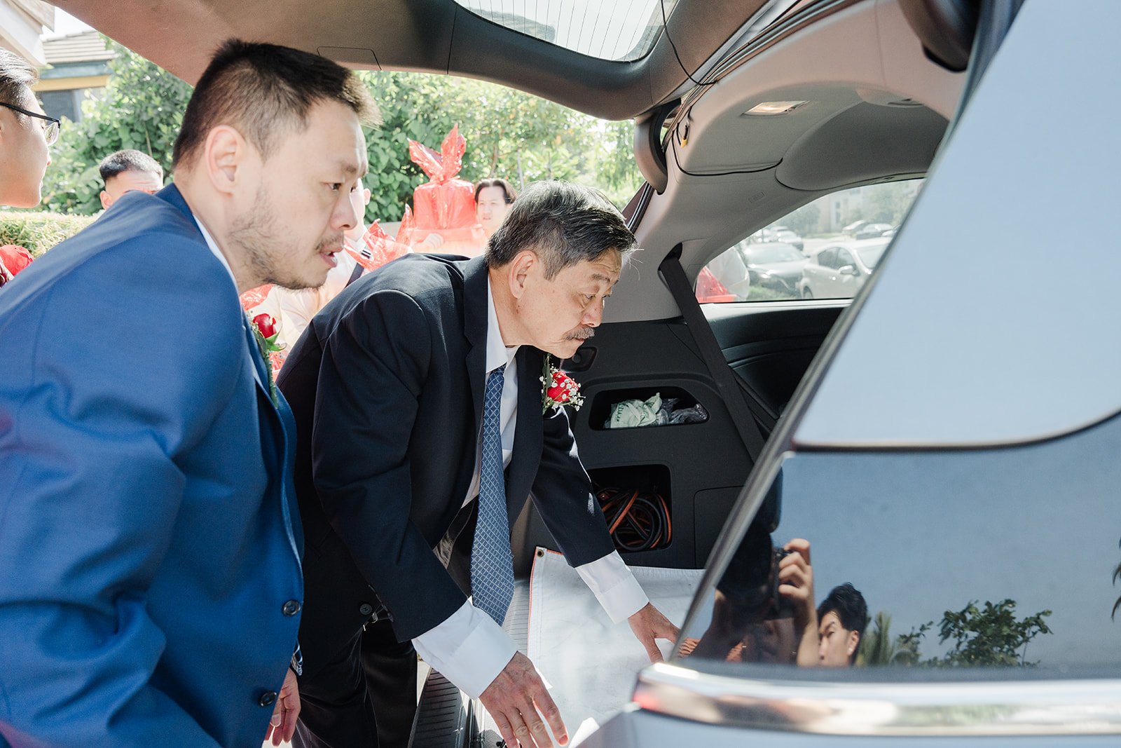 Danny and a groomsman unloading the car.