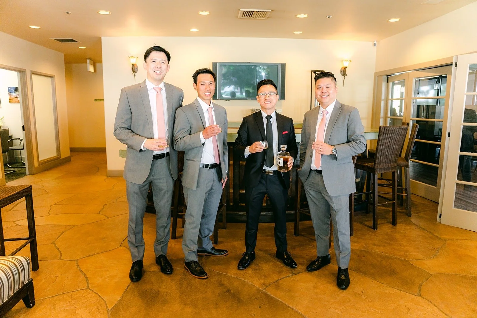Alex and his groomsmen in gray in the groom's room