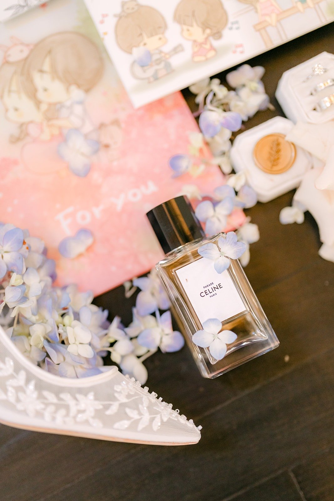 Elisa's perfume and beaded lace heel styled with pale blue blooms