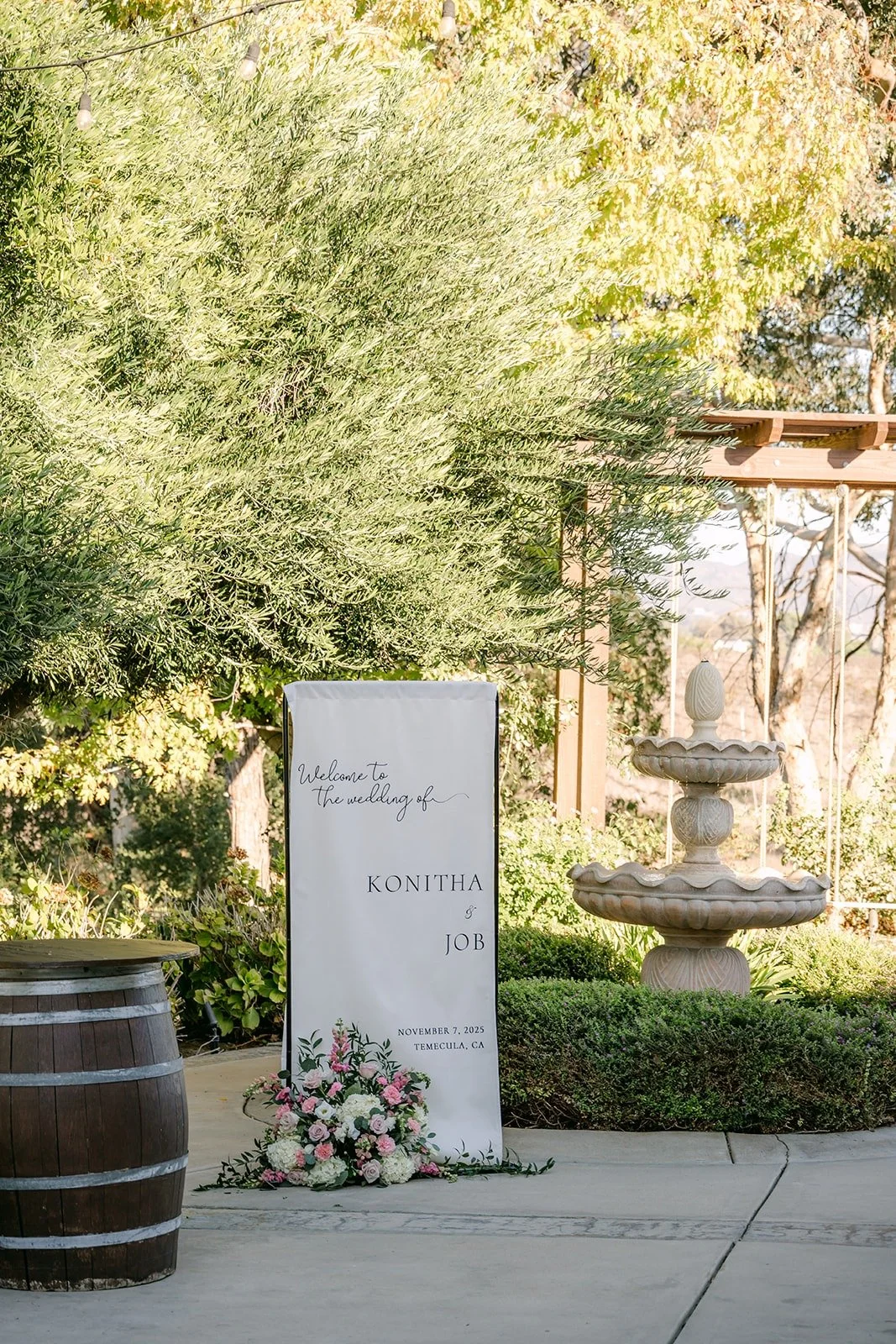 Welcome sign and fountain at the Bel Vino ceremony entrance