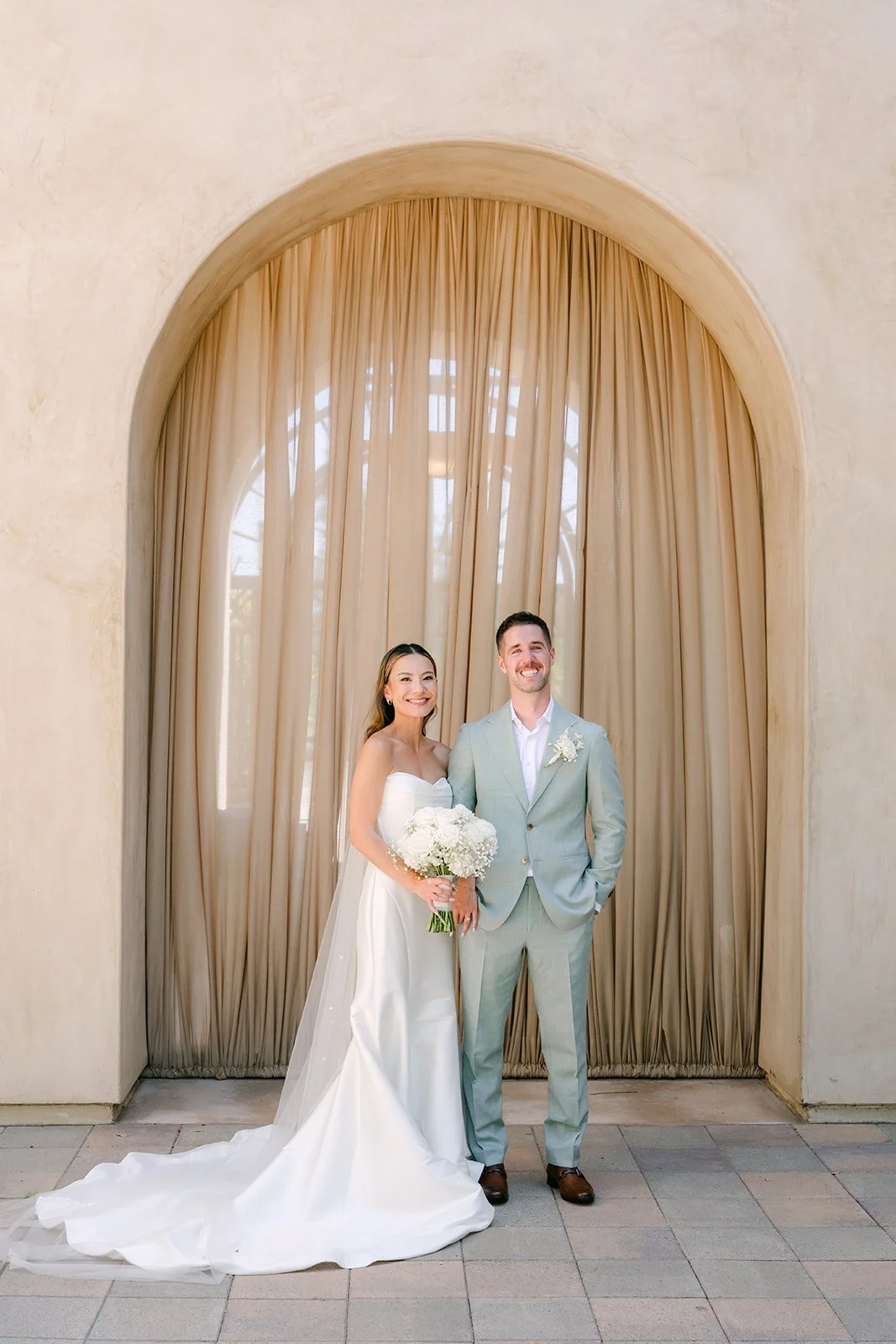 Kieu and Anthony standing together after their first look at Serra Plaza