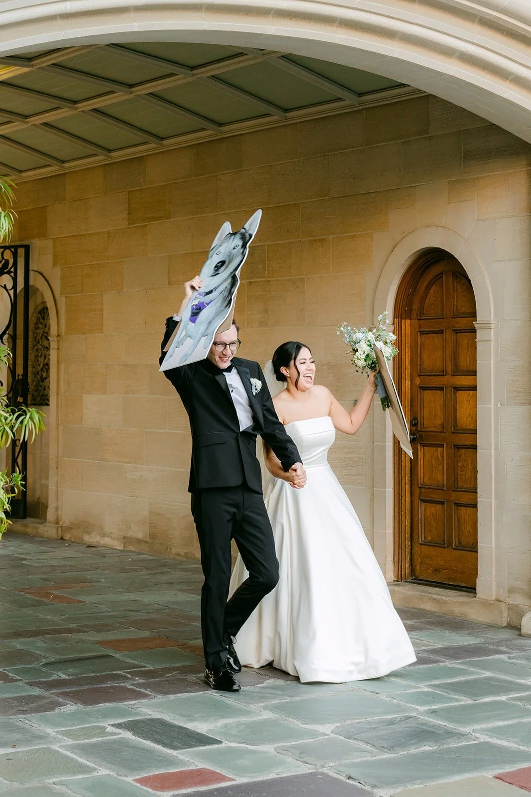 A groomsman waving a napkin as Brianna and Nik make their grand entrance