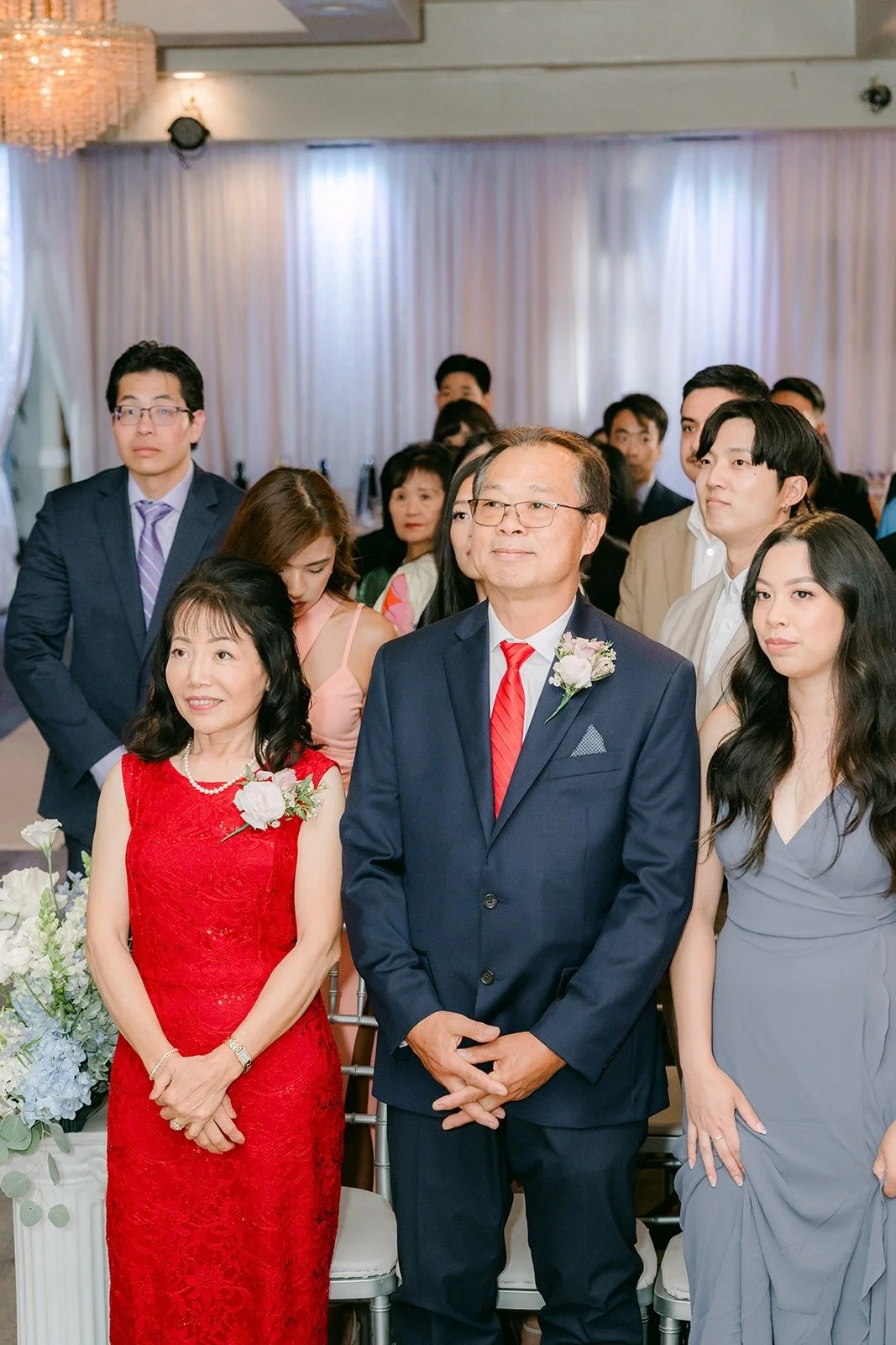 Family standing at the front of the ceremony