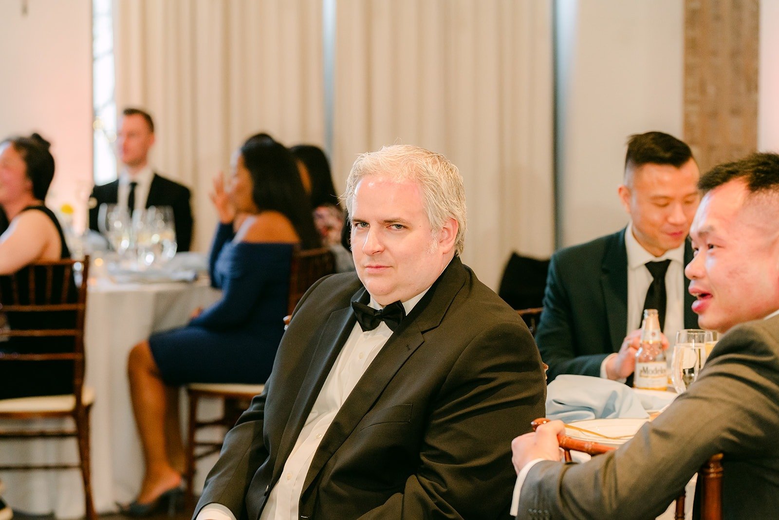 Guests laughing during the speeches