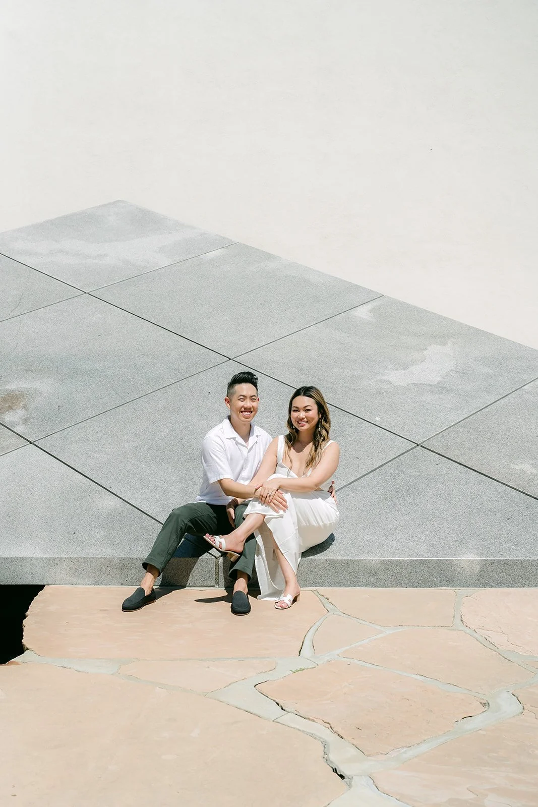 Stephanie and Alan seated at the base of the granite pyramid.