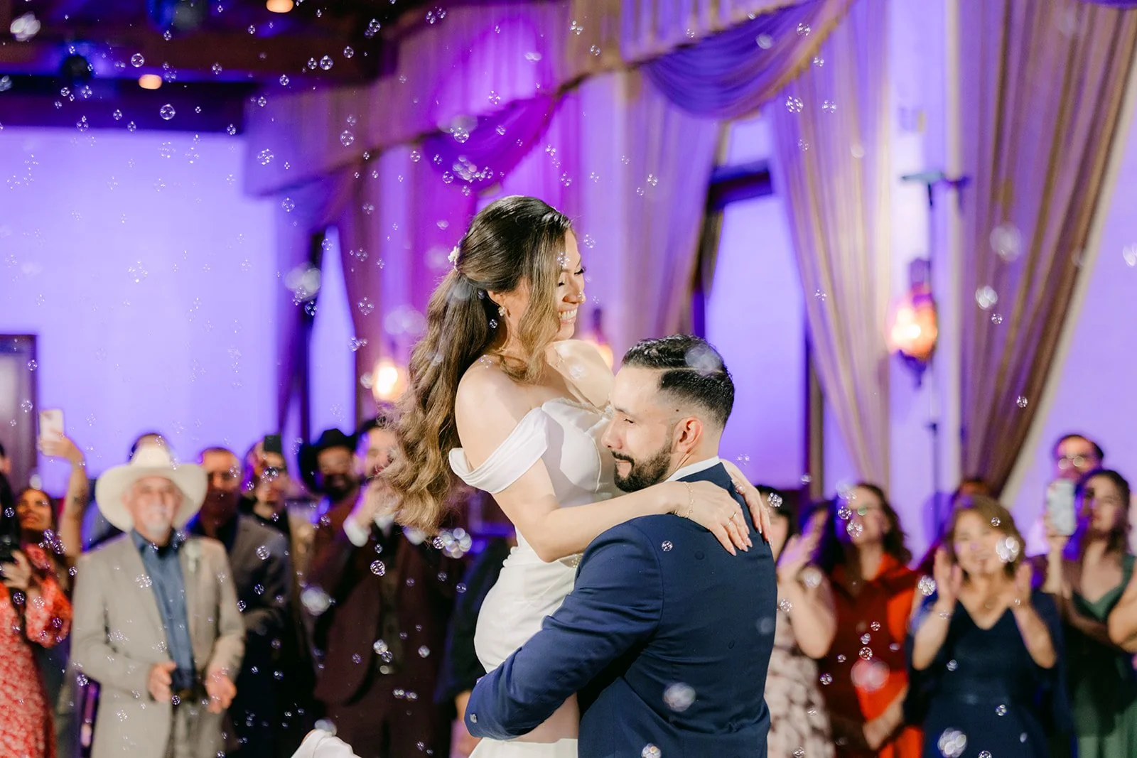 Danny dipping Mariana as guests cheer