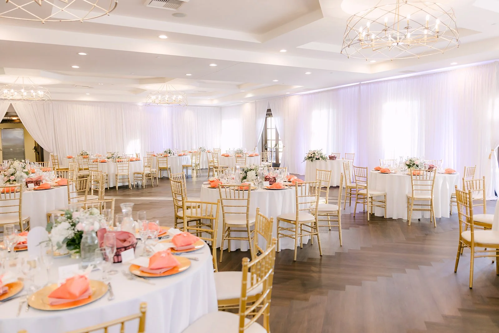 Second floor ballroom at Vellano Estate set with blush florals and draped walls