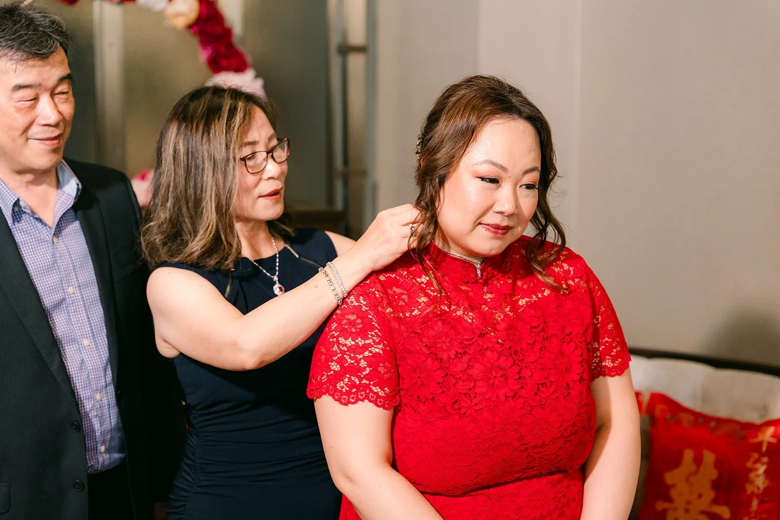 Mai receiving jewelry during the tea ceremony, photographed by One and Only Production.