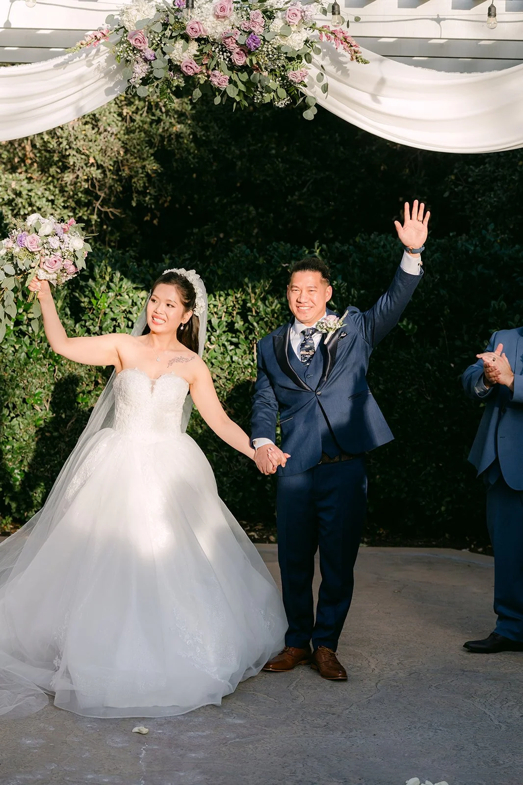 Kate and Michael celebrating under the pergola.