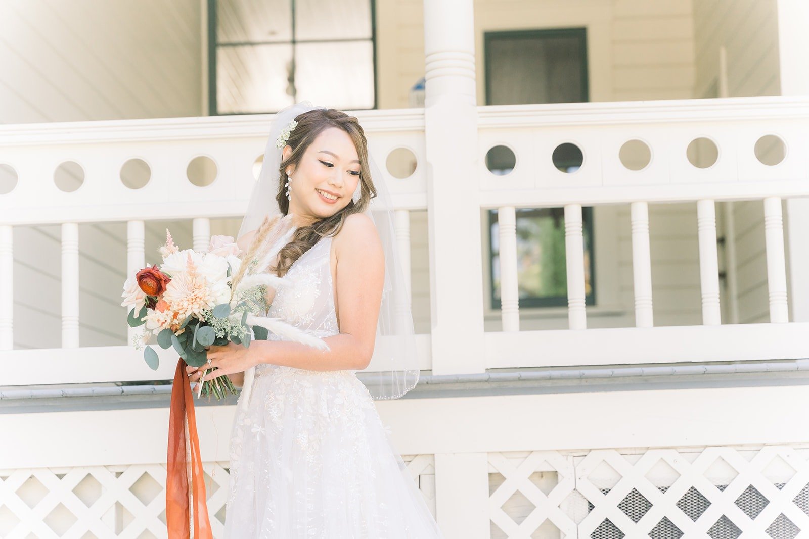 Ariel smiling on the porch before the first look