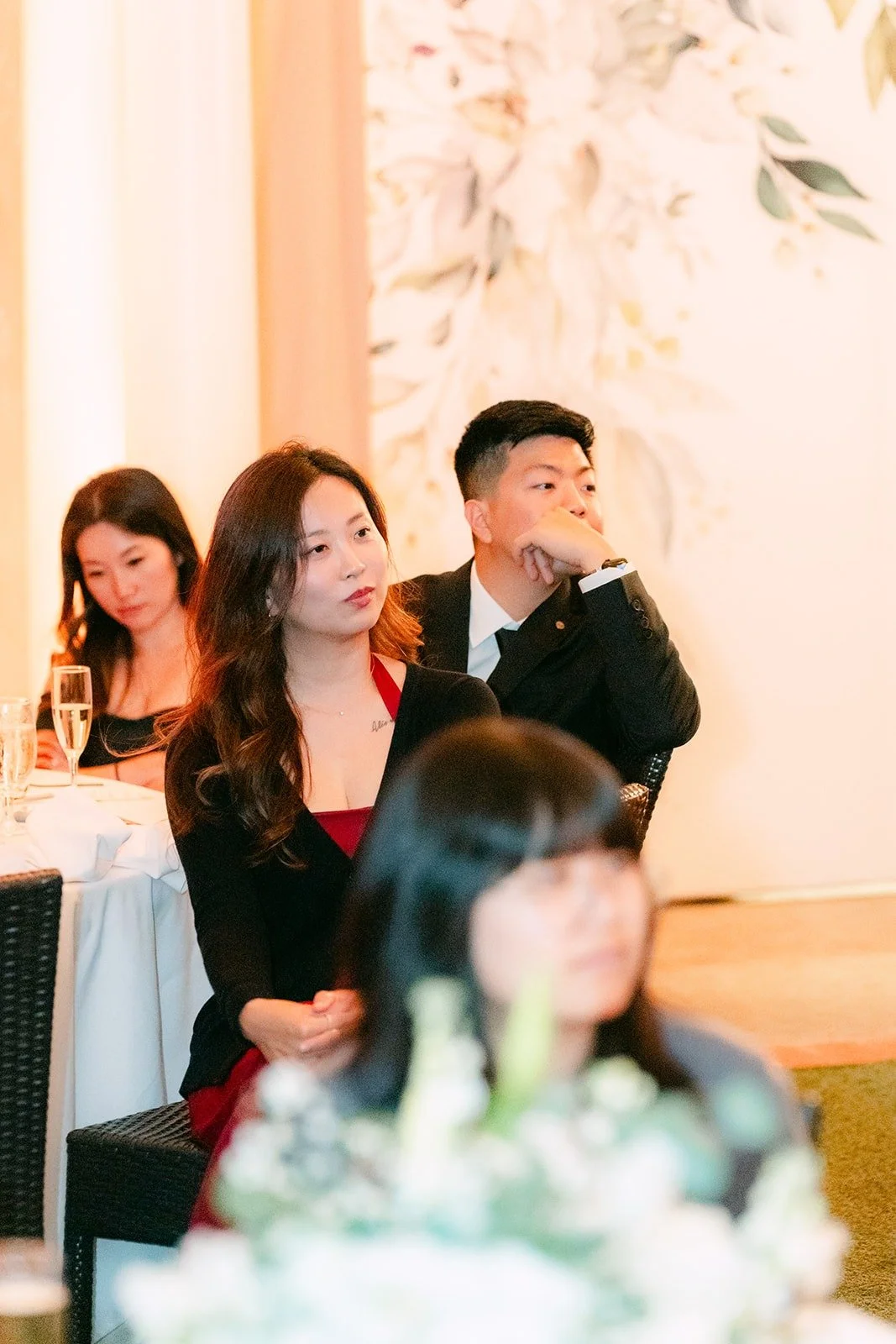 Guests laughing during the toasts