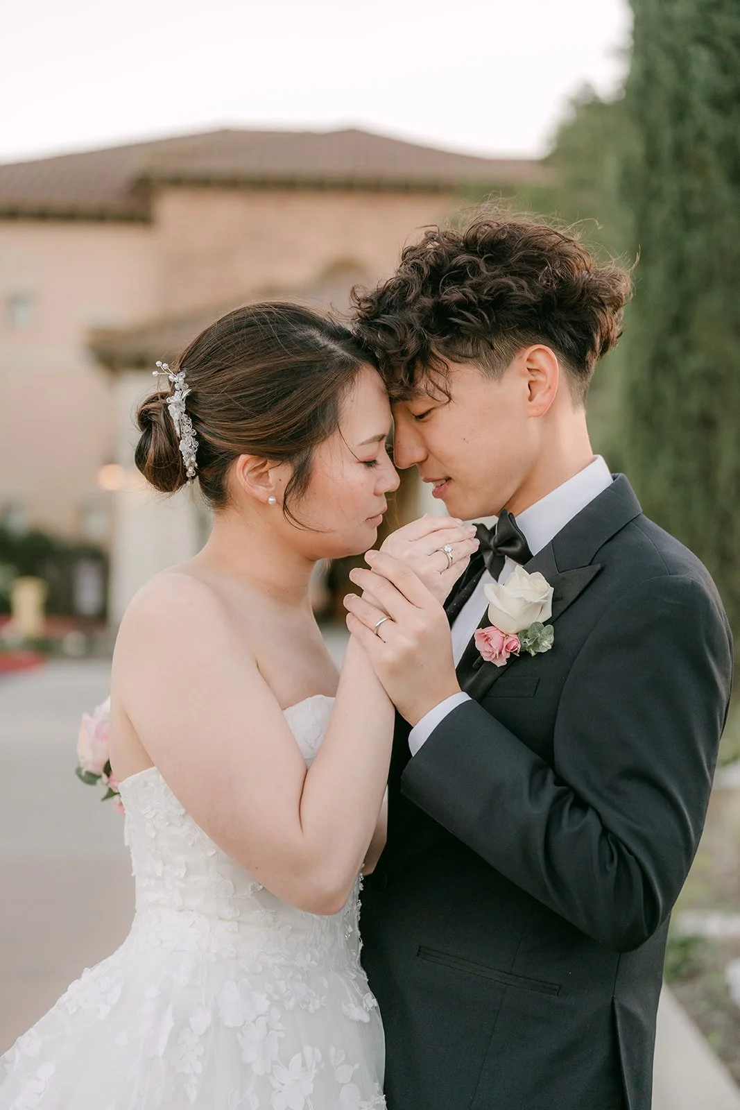 Victoria and Tony touching foreheads at dusk