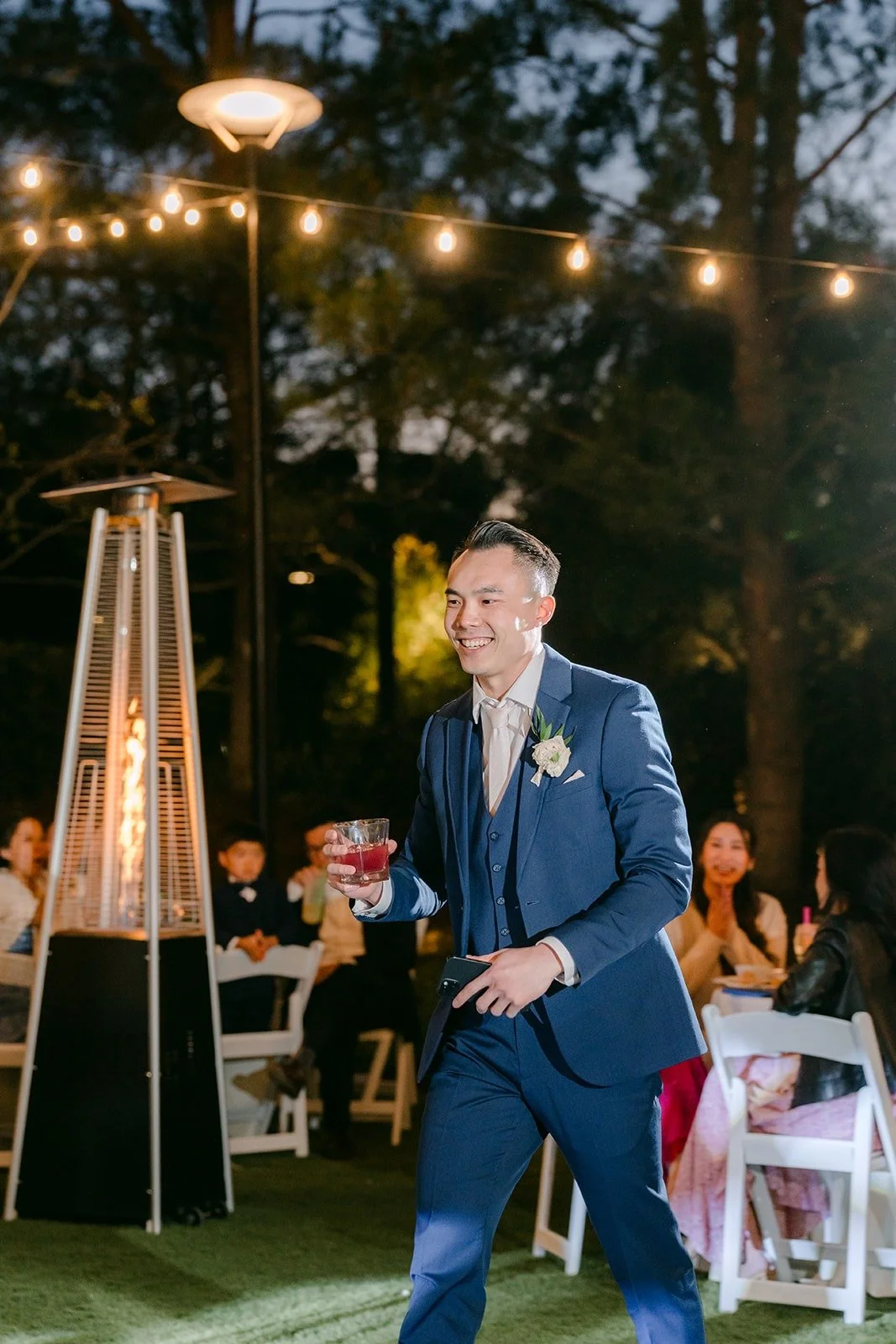 A toast under the string lights at Los Robles Greens