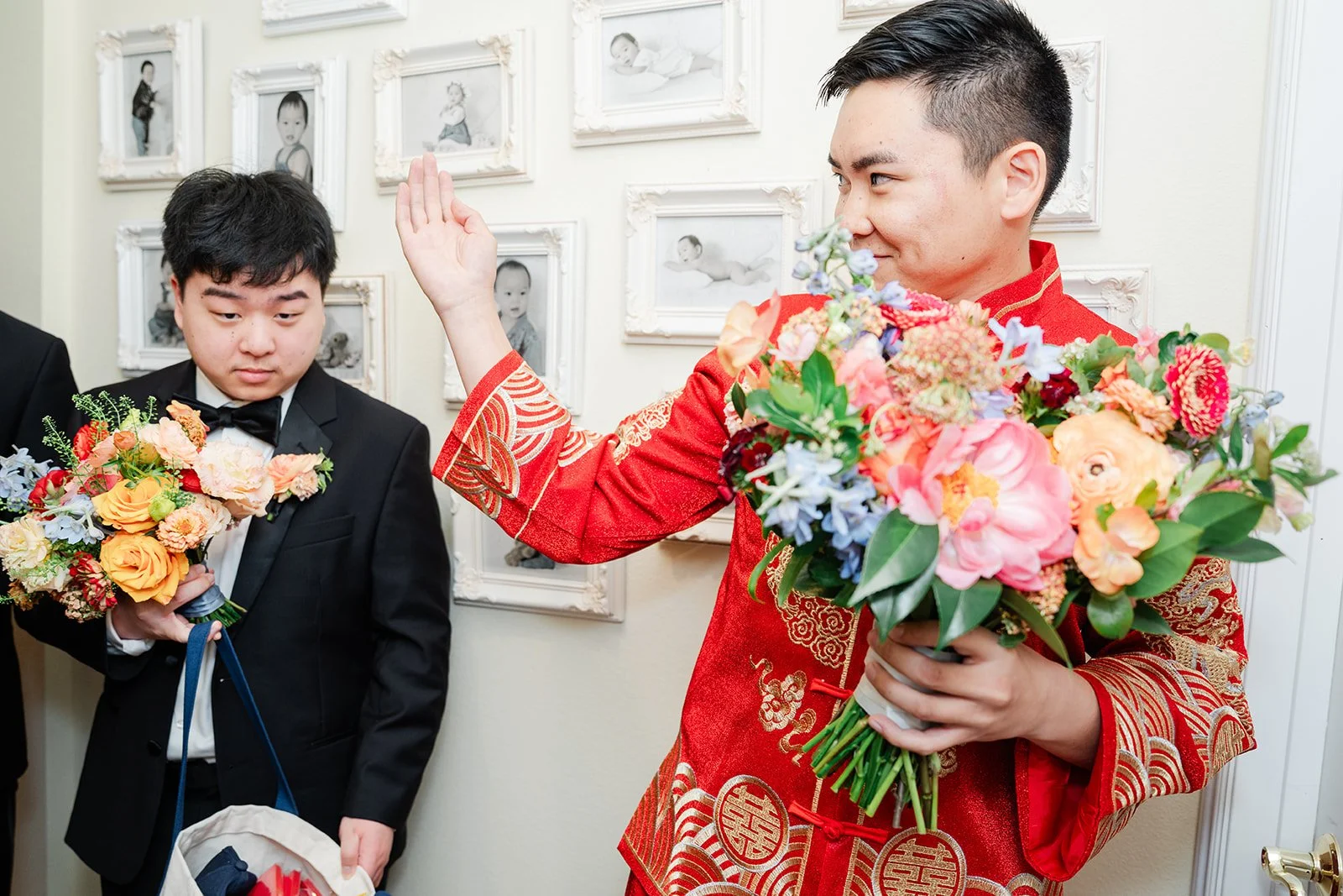 Henrik laughing as he holds up the bouquet.