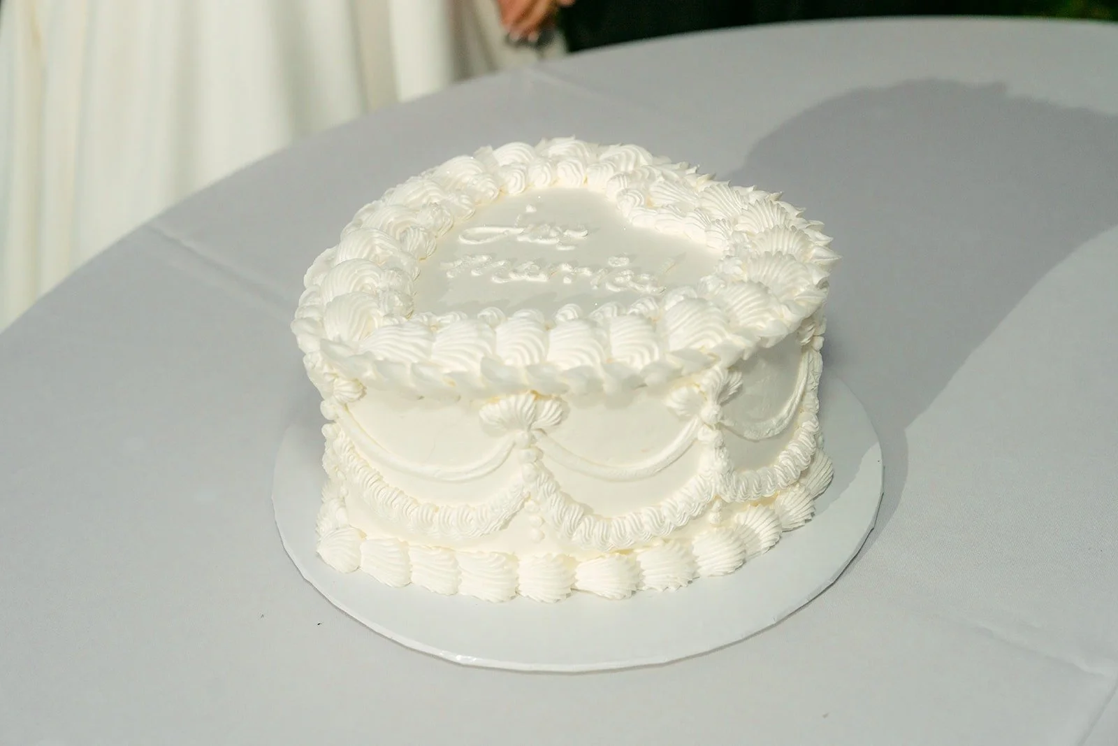 Brianna and Nik's small white buttercream cake