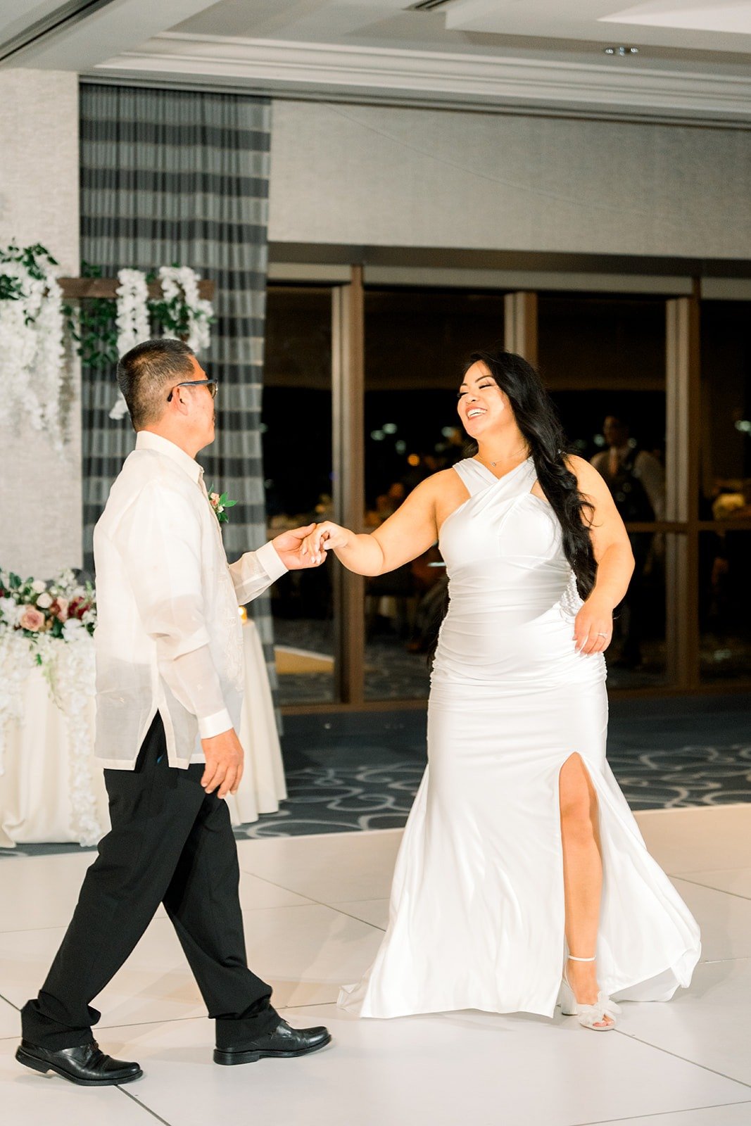 Betsy dances with a family member during the parent dances