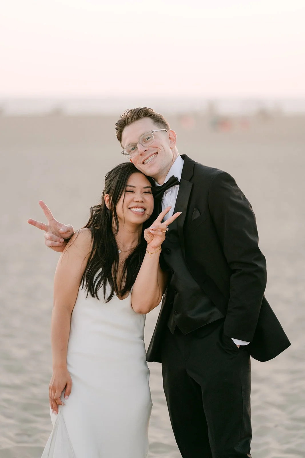 Peace signs from the newlyweds