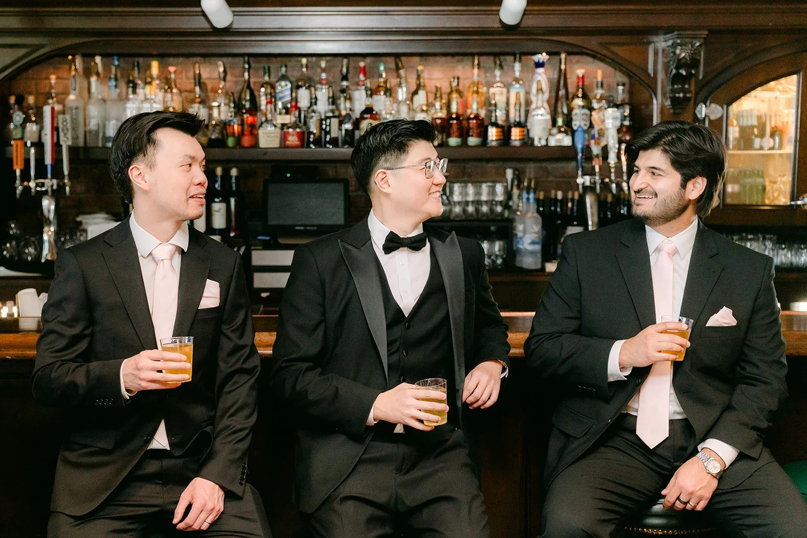Joshua and his groomsmen at the bar