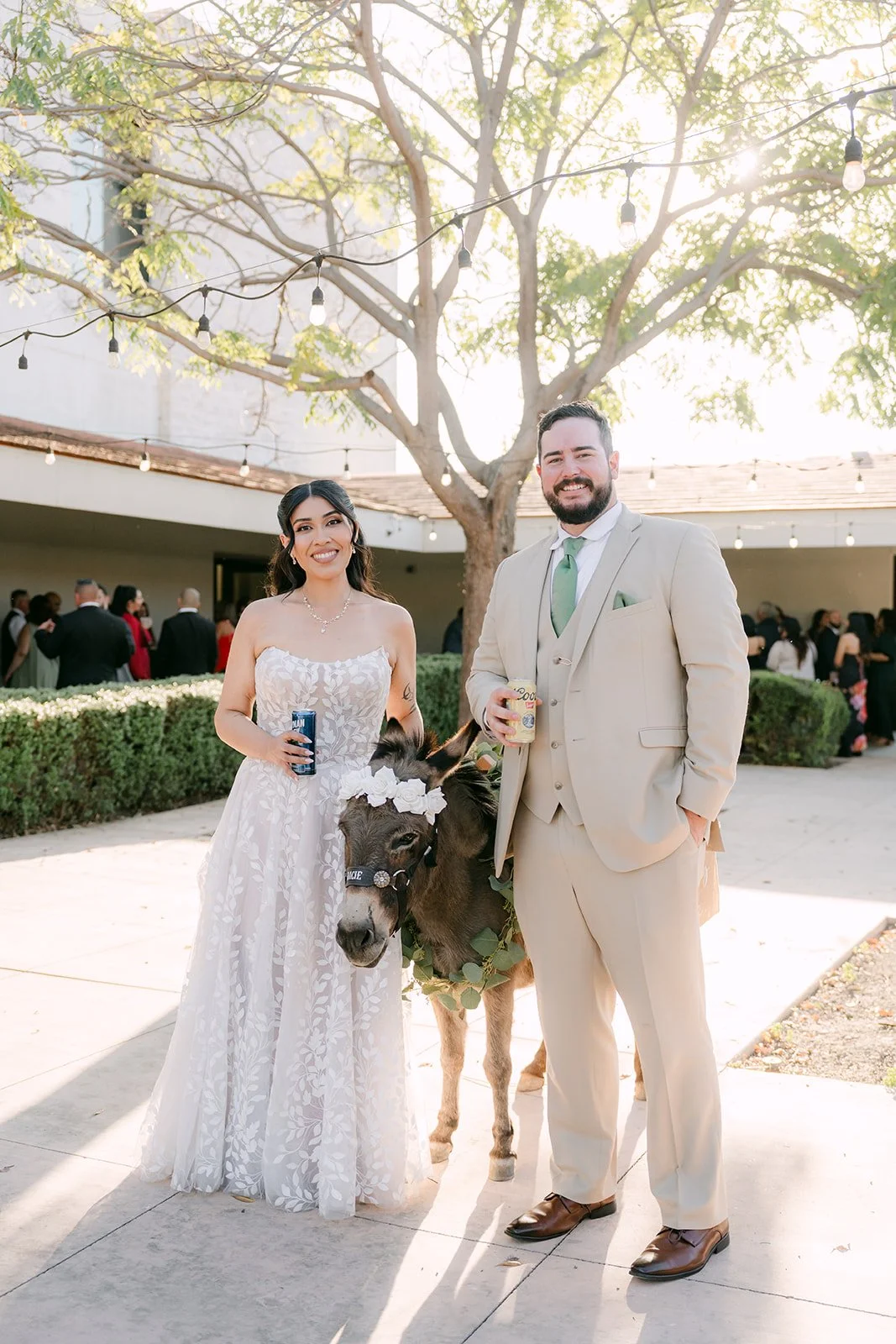 Fernanda and Cody posing with the beer donkey in the courtyard.