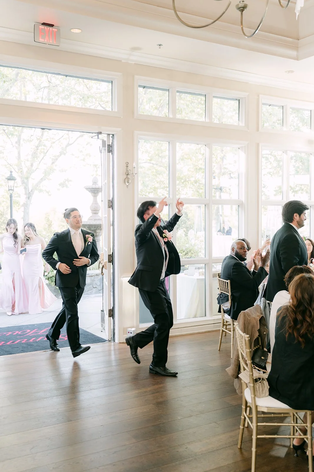 The groomsmen dancing into the reception