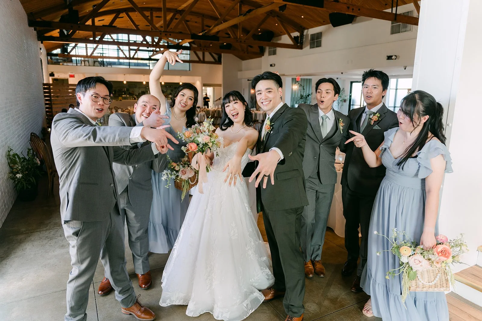 Wedding party celebrating with the couple after the ceremony, photographed by One and Only Production