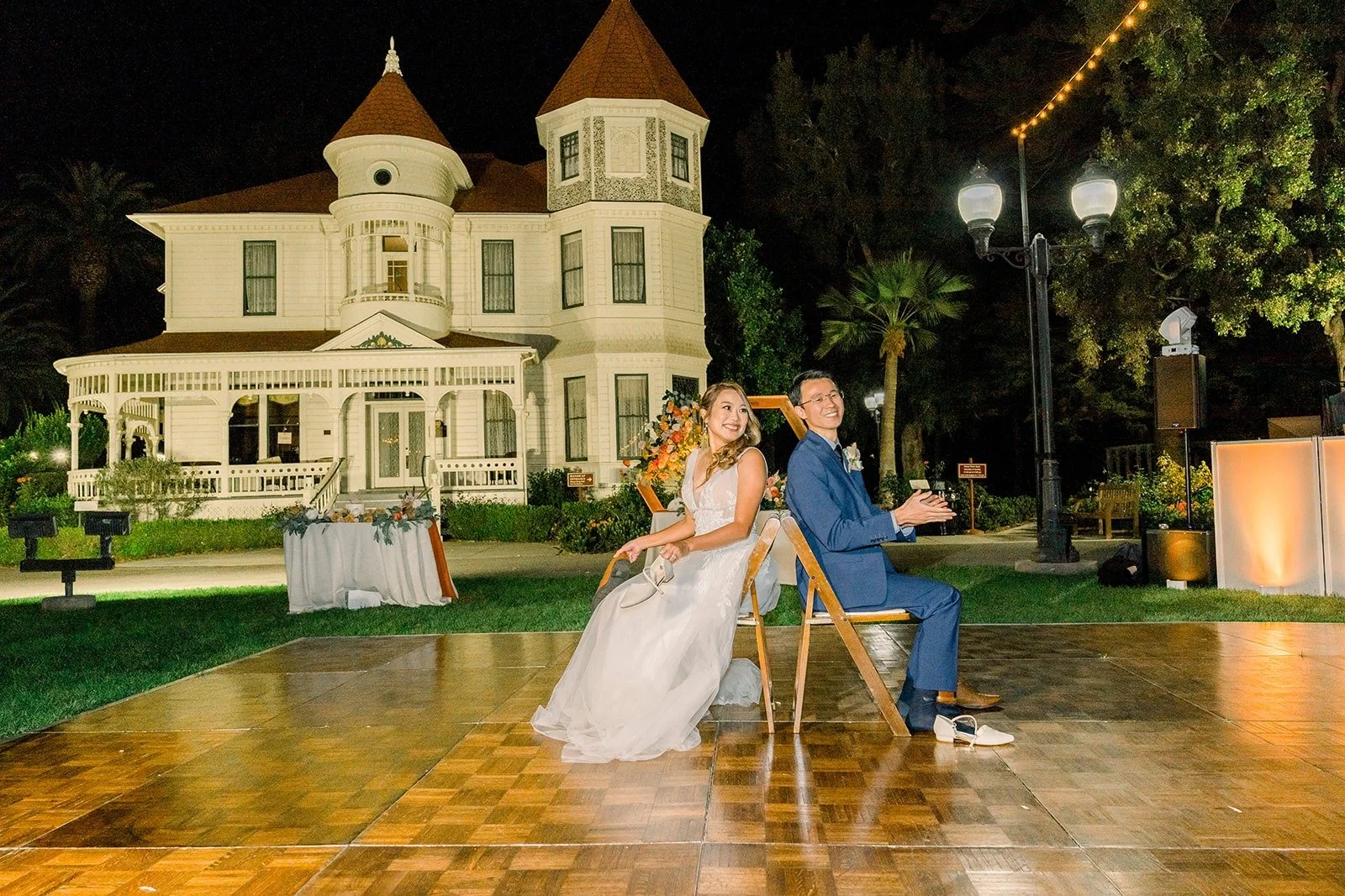 Ariel and Alex playing a game on the dance floor at night
