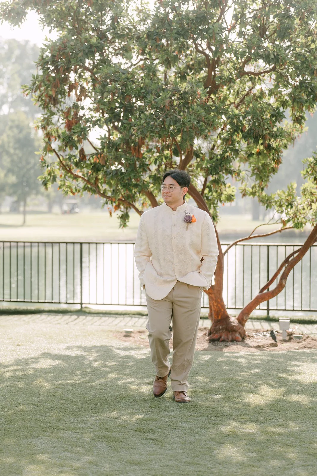 Jacob walking across the lawn in his barong
