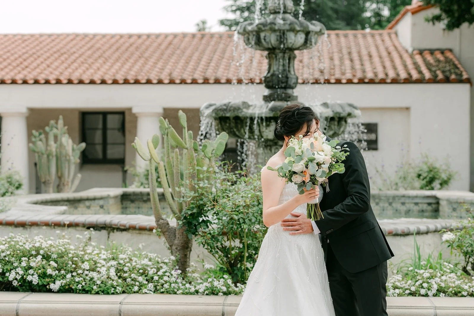 Eunice and Eric hug after their first look, photographed by One and Only Production