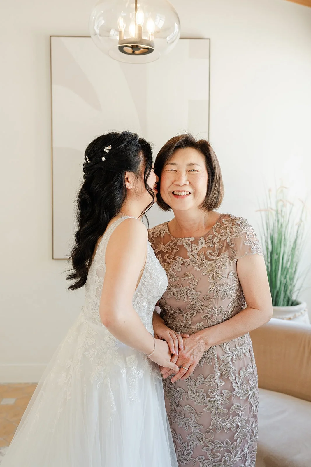 Constance hugging her mom in her sparkling gown before the ceremony