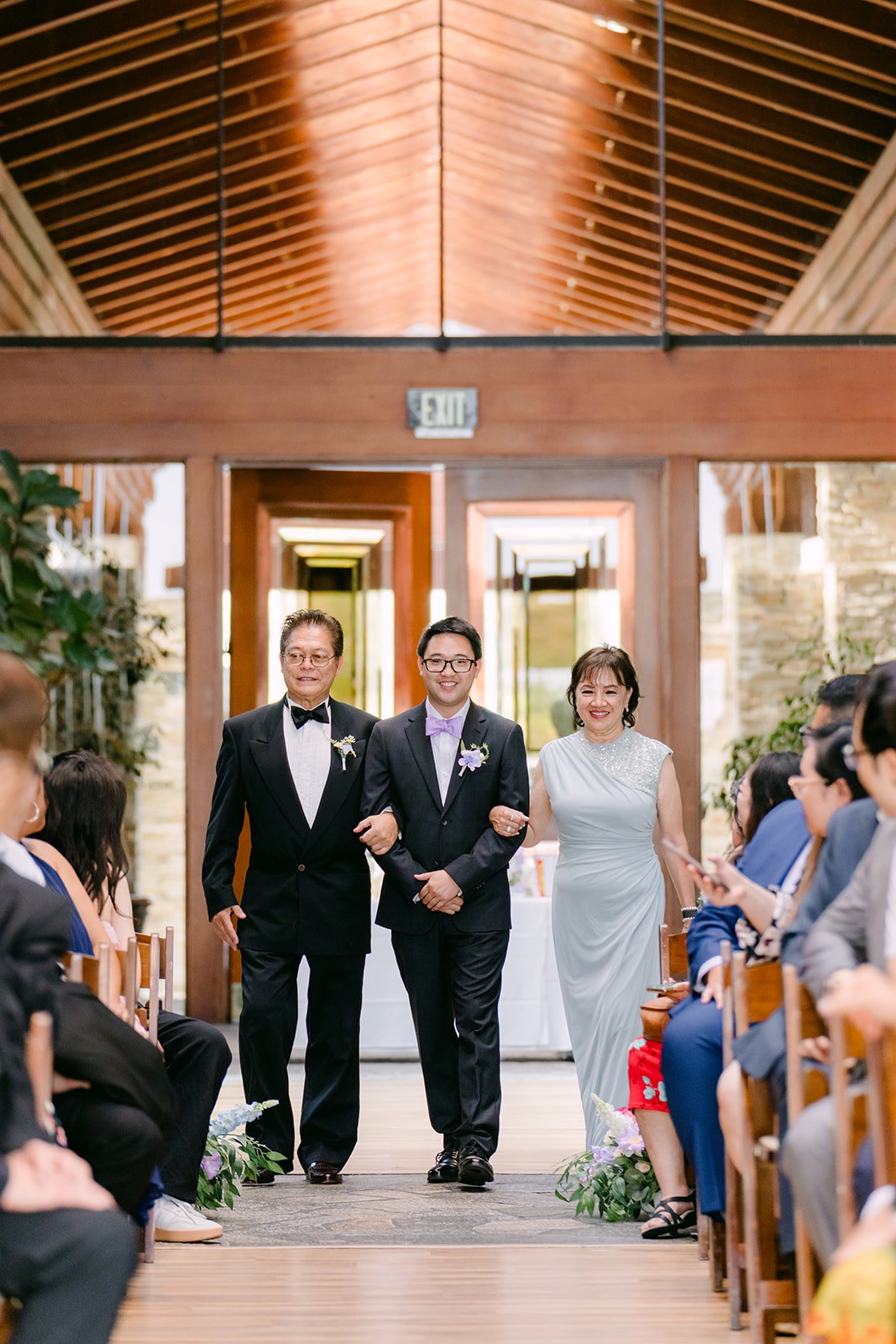 Patrick walking down the aisle with his parents